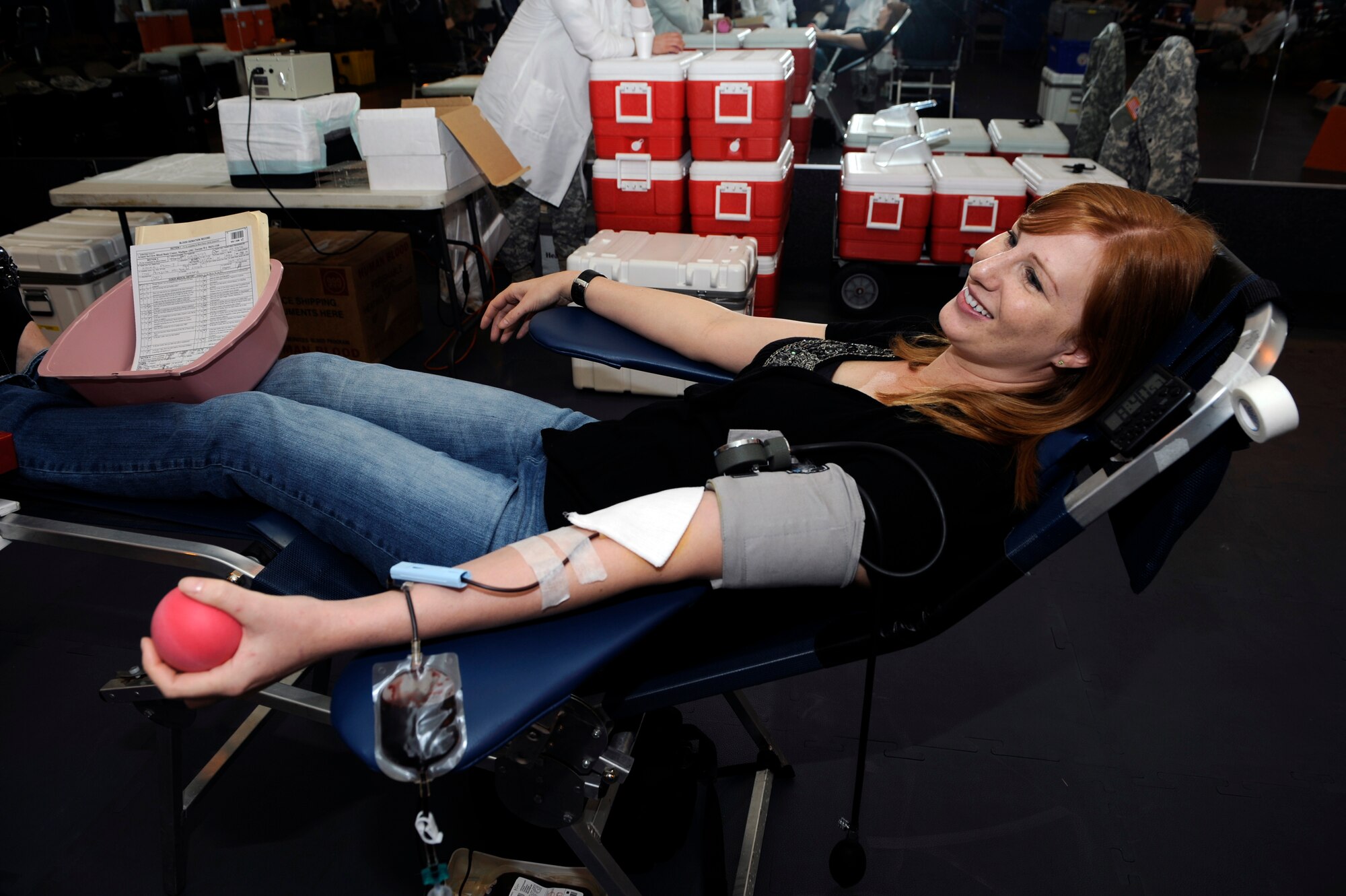 MOUNTAIN HOME AIR FORCE BASE, Idaho – Feona Nowak, wife of Master Sgt. Jeremy Nowak, 366th Operations Support Squadron, donates blood April 15 at the base fitness center. (U.S Air Force photo by Senior Airman Angelina Drake)