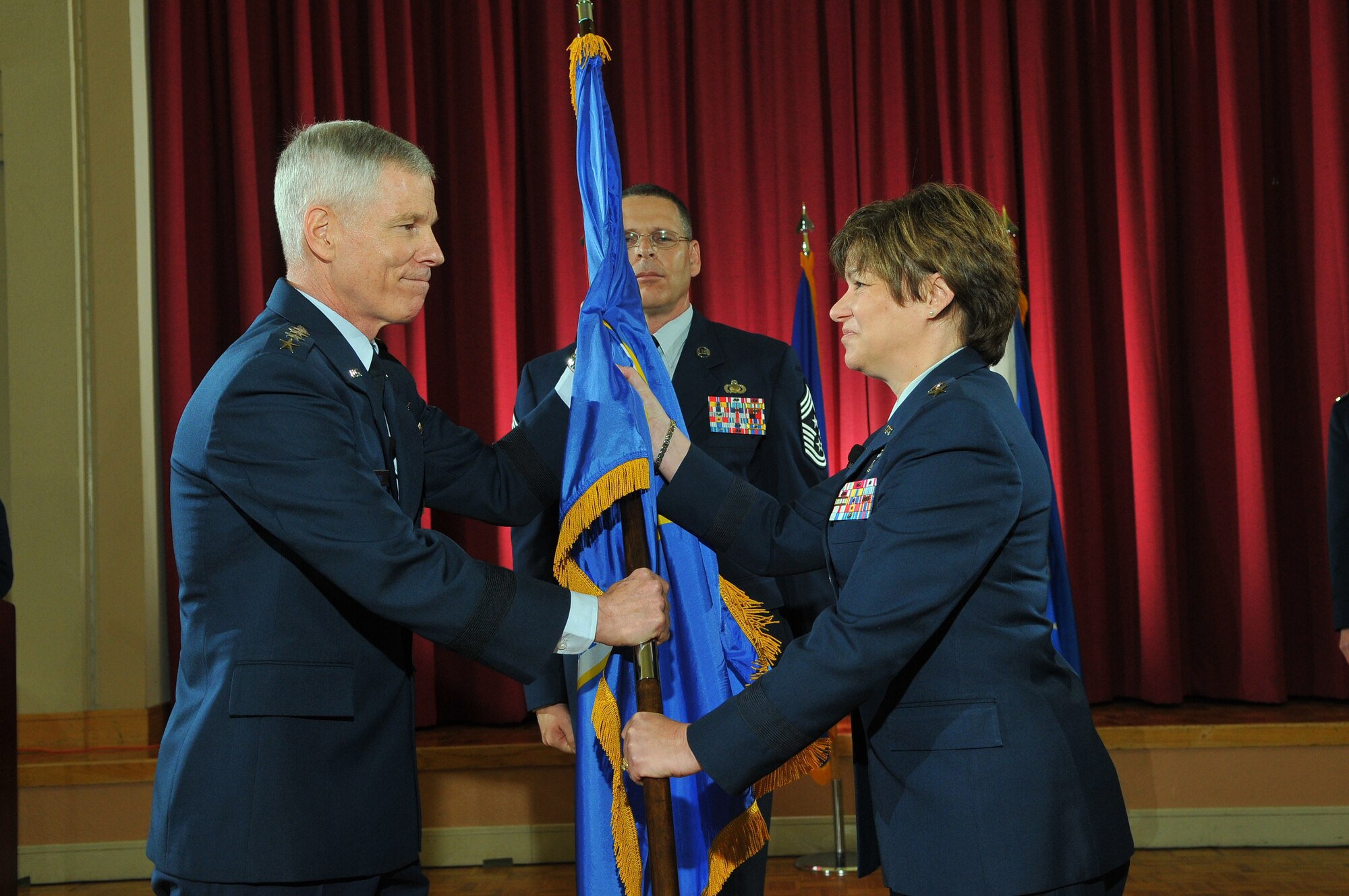 General William L. Shelton (left) Air Force Space Command commander, gives command of 24th Air Force to Maj. Gen. Suzanne M. Vautrinot during the unit's first change of command ceremony at the Gateway Club, Lackland Air Force Base, Texas, April 29. General Vautrinot is now responsible for the Air Force’s newest numbered air force providing combatant commanders with trained and ready cyber forces which plan and conduct cyberspace operations. (U.S. Air Force photo by William Belcher)