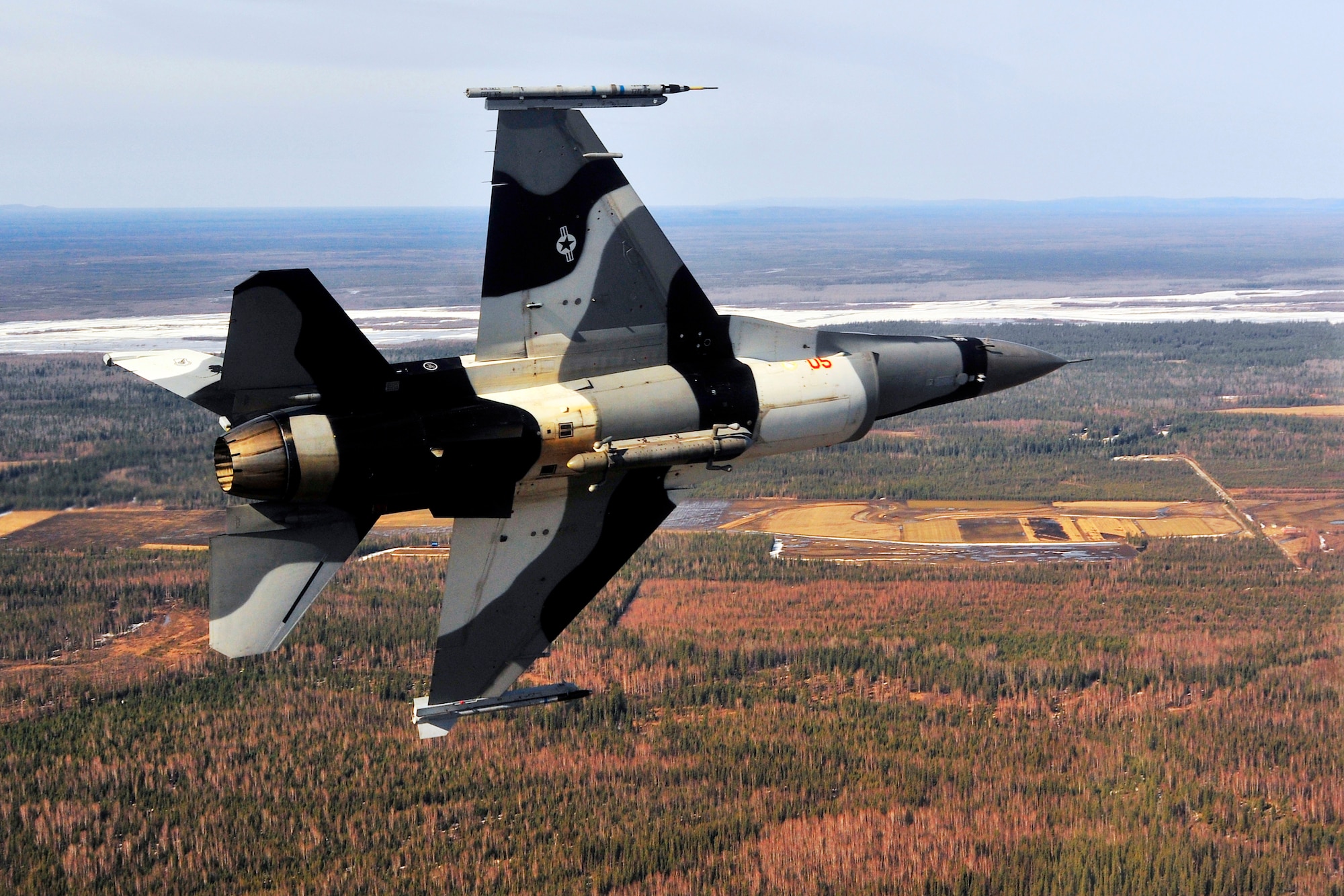 Maj. Mark Schmidt maneuvers in to position for final approach in an F-16 Fighting Falcon during RED FLAG-Alaska 11-1 April 29, 2011, Eielson Air Force Base, Alaska. RF-A provides unique opportunities to integrate various forces into joint, coalition and bilateral training from simulated forward operating bases. Major Schmidt is an F-16 pilot assigned to the 18th Aggressors Squadron. (U.S. Air Force photo/Staff Sgt. Christopher Boitz)