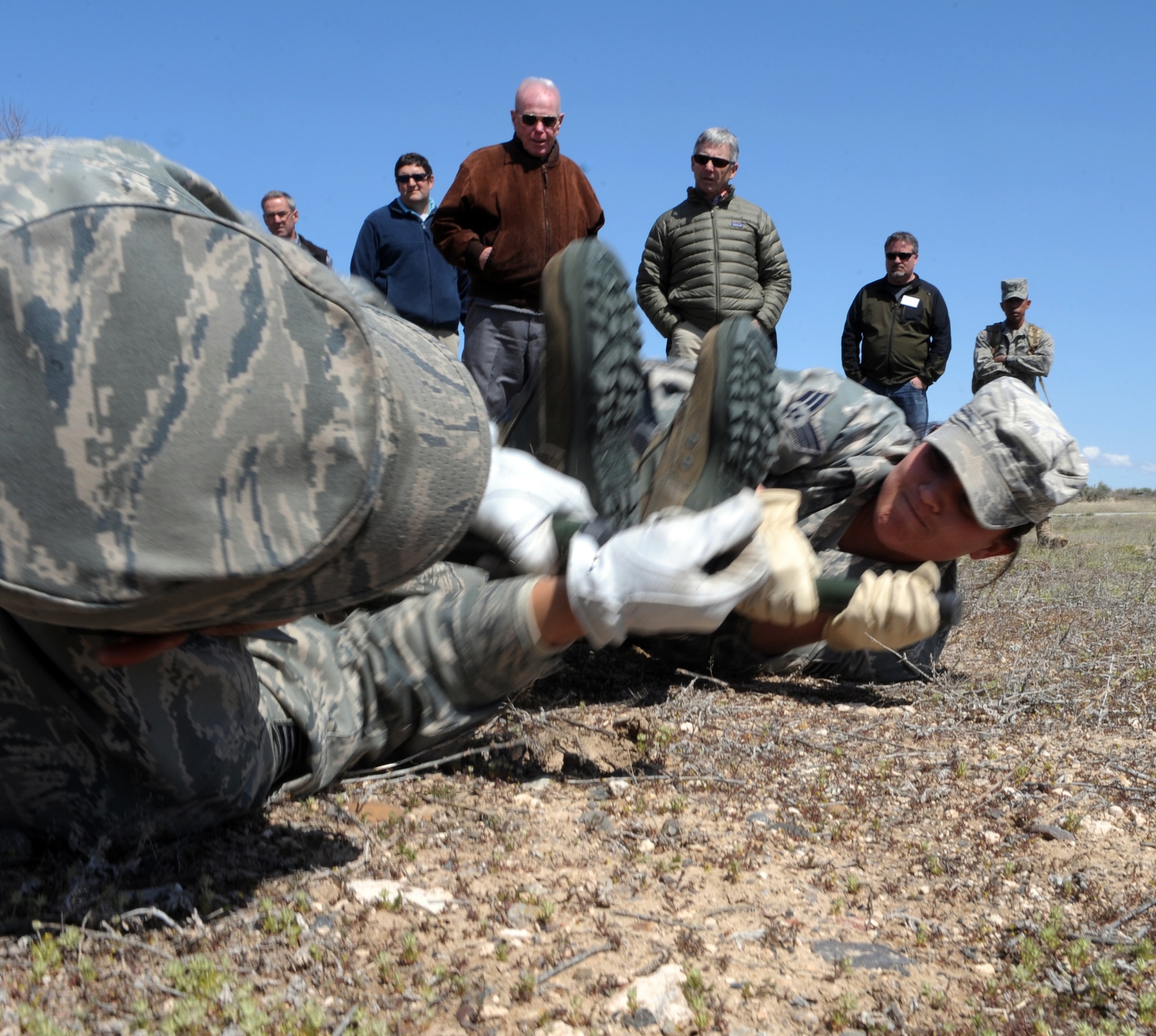 MOUNTAIN HOME AIR FORCE BASE, Idaho – Senior Airman Julia Faulks and Senior Airman Ricardo Oliver, both assigned to the 366th Medical Group, demonstrate litter carries to honorary commanders during the 366th Medical Group honorary commander tour at the hospital April 22. The honorary commanders program is a wing-level program that pairs civic leaders with squadron, group and wing leaders to enhance the relationships between local communities and the base. It also provides a glimpse of military life to members of neighboring communities -- many of whom have no connection to the Air Force. (U.S. Air Force photo by Senior Airman Debbie Lockhart)