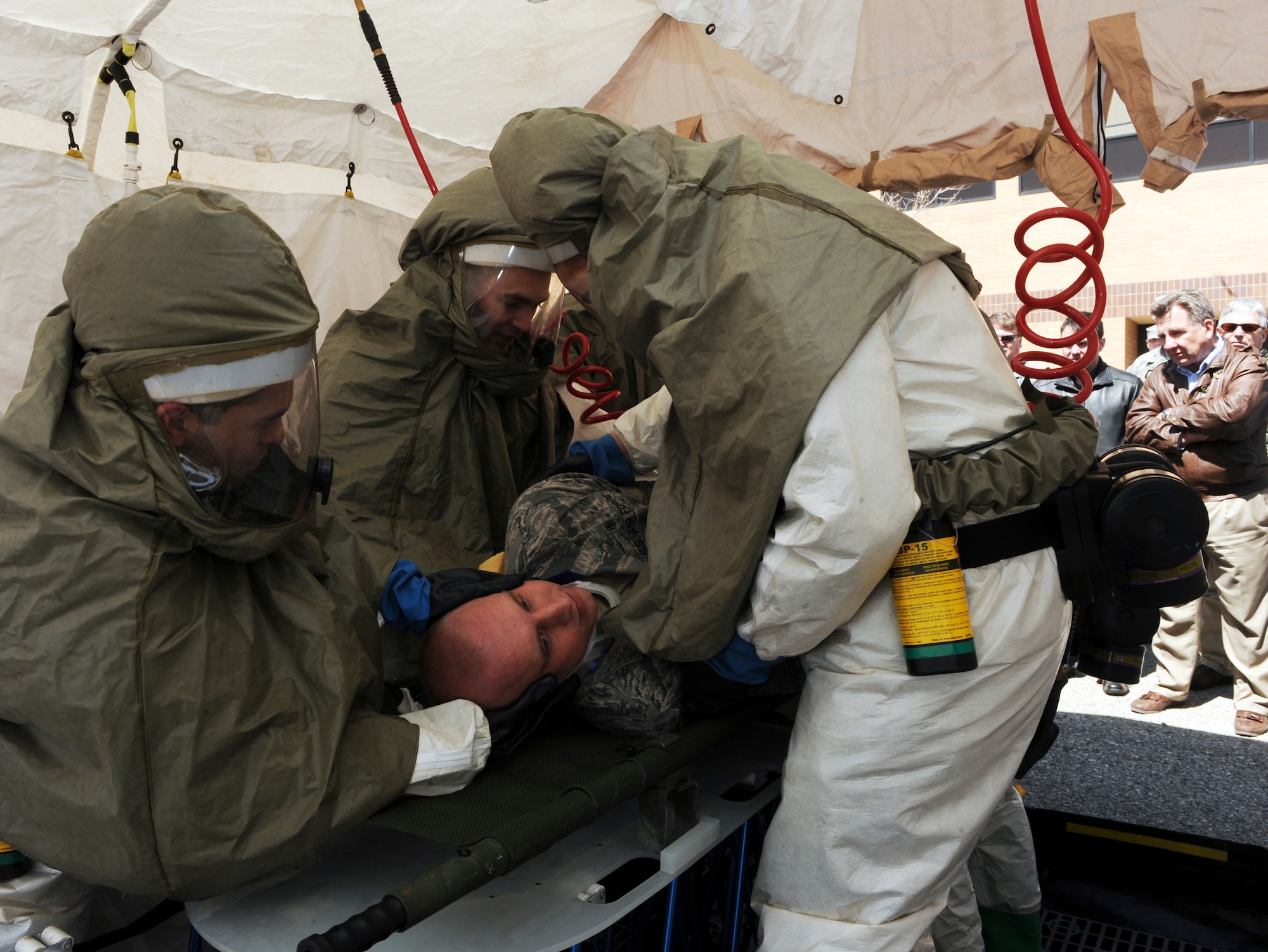 MOUNTAIN HOME AIR FORCE BASE, Idaho – Airmen from the 366th Medical Group demonstrate proper chemical, biological, radiological, nuclear and enhanced explosive medical first response procedures during the 366th Medical Group honorary commander tour at the hospital April 22. The honorary commanders program is a wing-level program that pairs civic leaders with squadron, group and wing leaders to enhance the relationships between local communities and the base. It also provides a rare glimpse of military life to members of neighboring communities -- many of whom have no connection to the Air Force. (U.S. Air Force photo by Senior Airman Debbie Lockhart)