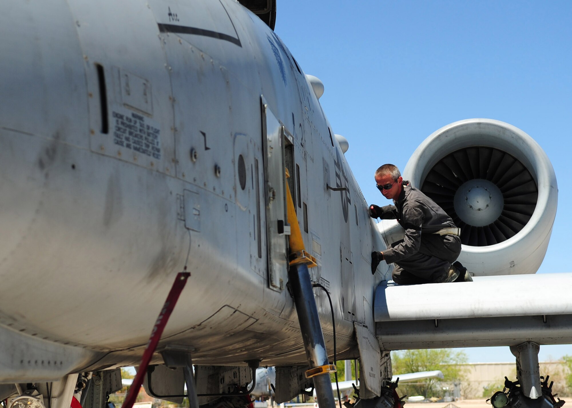 TUCSON, Ariz. - An A-10 Crew Chief from the 355th Aircraft Maintenance Squadron inspects his aircraft on the flight line at Tucson International Airport here April 27. D-M closed its runway for routine maintenance in March. Routine maintenance is required to preserve the integrity of the runway and was last performed in 2002. (U.S. Air Force photo/Airman 1st Class Jerilyn Quintanilla)