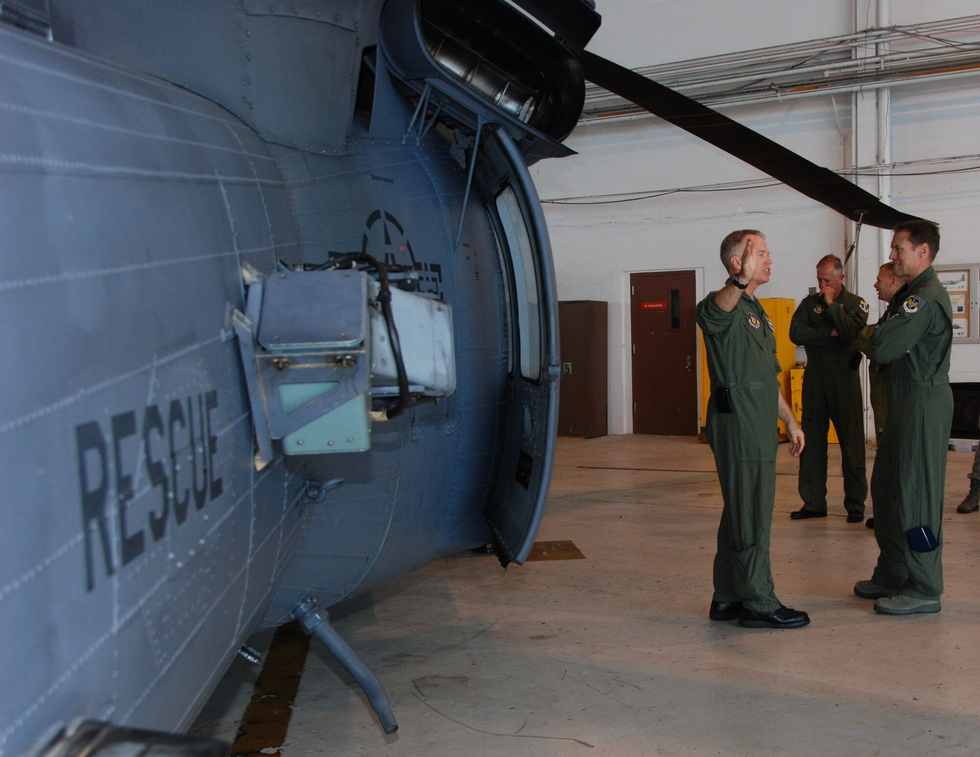 Col. Chris Hannon, 920th Rescue Wing director of operations, talks about the capabilities of the HH-60G helicopter  with Brig. Gen. Robert Branyon, 1st Air Force vice commander during a tour of search and rescue assets April 28 at Patrick AFB, Fla. (U.S. Air Force photo by: Capt. Jared Scott)