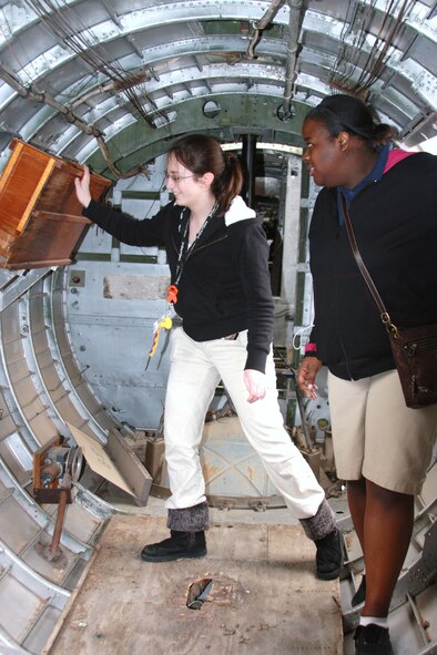 Cadet lst Lt. Katie Jo Kitchings, left, and Cadet 2nd Lt. Shay Jeter, both of Parkway High School's Junior ROTC, get familiar with the inside of a B-17 at the Eighth Air Force Museum Airpark at Barksdale Air Force Base, La., April 19, as part of the museum's new Partners In Education Program. (U.S. Air Force photo/Tech. Sgt. Marcus McDonald)(RELEASED)