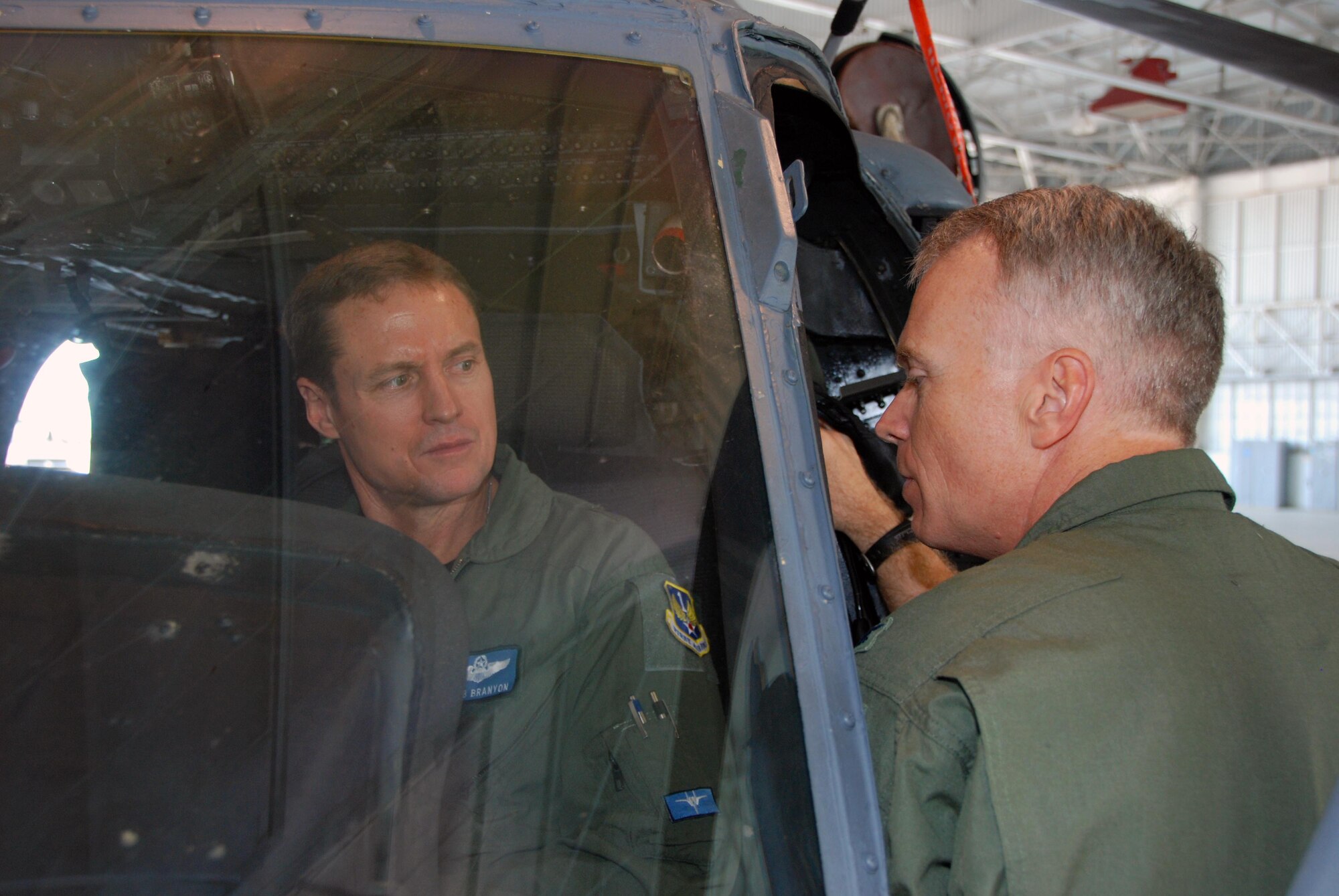 Brig. Gen. Robert  Branyon, 1st Air Force vice commander, listens as Col. Chris Hannon, director of operations at the 920th Rescue Wing, Patrick AFB, Fla., describes the inside of a HH-60G Pave Hawk helicopter during a tour April 28. (U.S. Air Force photo by: Capt. Jared Scott)