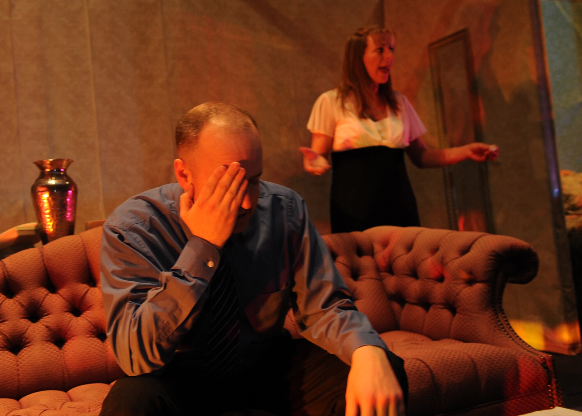 BUCKLEY AIR FORCE BASE, Colo. -- Tech. Sgt. David Priest, Aerospace Data Facility Colorado and Janet Evans, 460th Forces Support Squadron A Basin Child Development Center director, act out a scene as Sam and Karen Nash from Neil Simon's "Plaza Suite" April 29, 2011. Showing tonight at 1900 at the LDC, Team Buckley volunteers will be performing the first ever theater production at Buckley AFB. (U.S. Air Force photo by Airman1st Class Marcy Glass)