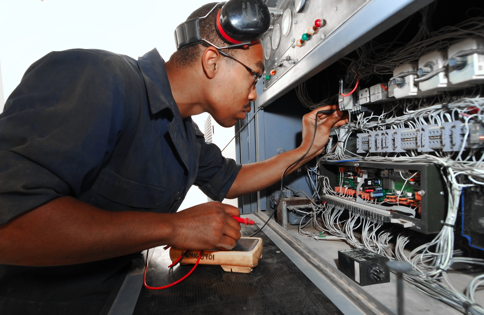 Staff Sgt. Steven Jackson uses a multimeter to check for electrical continuity on a generator April 6, 2011, at an air base in Southwest Asia. Sergeant Jackson is a maintainer assigned to the 386th Expeditionary Maintenance Squadron. (U.S. Air Force photo/Senior Airman Cynthia Spalding)
