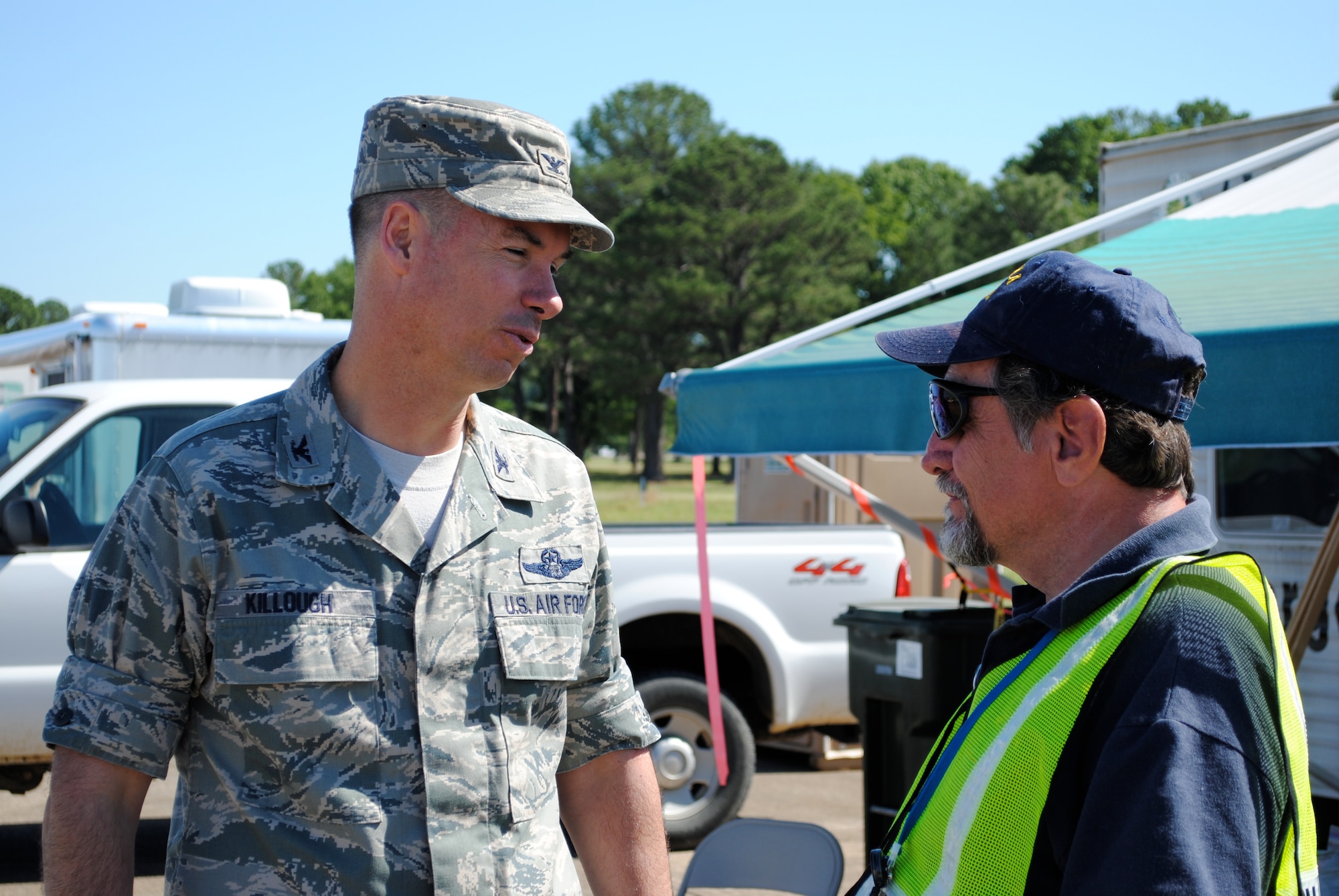 Col. Brian Killough, 42d Air Base Wing commander, talks to an emergency worker at the Maxwell Air Force Base, Ala., staging area on April 29, 2011. Maxwell is serving as a staging area for the response to the tornado disaster that pummeled Alabama April 27. (Air Force photo/Christopher Kratzer)