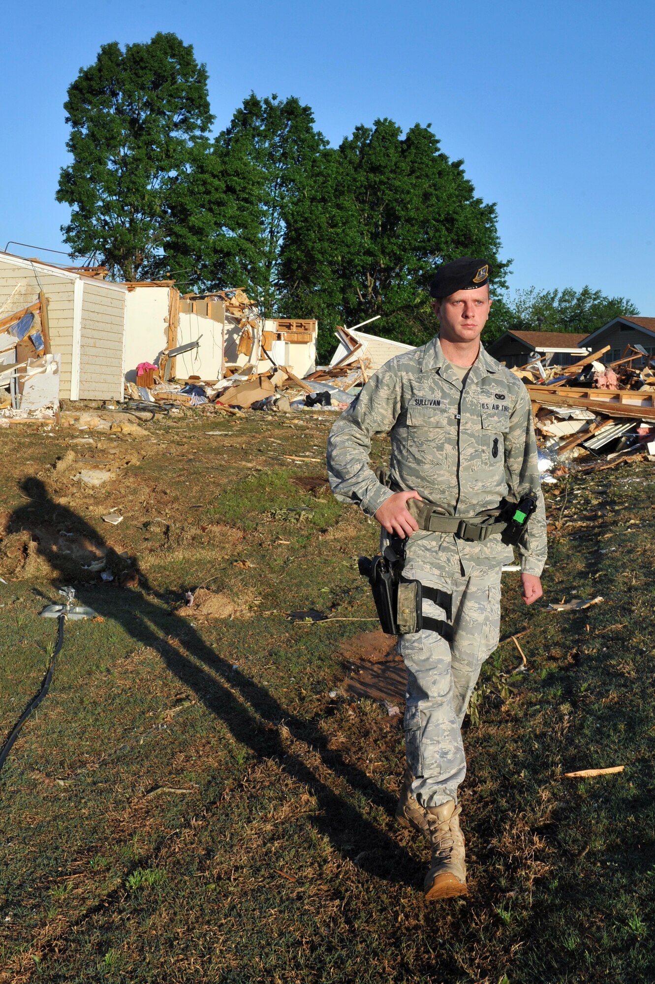 Airman 1st Class John Sullivan, a 19th Security Forces Squadron patrolman, patrols base housing to prevent people from entering condemned houses April 29, 2011, on Little Rock Air Force Base, Ark.  19th SFS Airmen are pulling 24-hour patrols in base housing after an EF-2 tornado on the Enhanced Fujita Scale (111-135 mph) struck the base at approximately 8 p.m. April 25, damaging aircraft, multiple work centers and approximately 100 base housing units. (U.S. Air Force photo by Staff Sgt. Chris Willis)