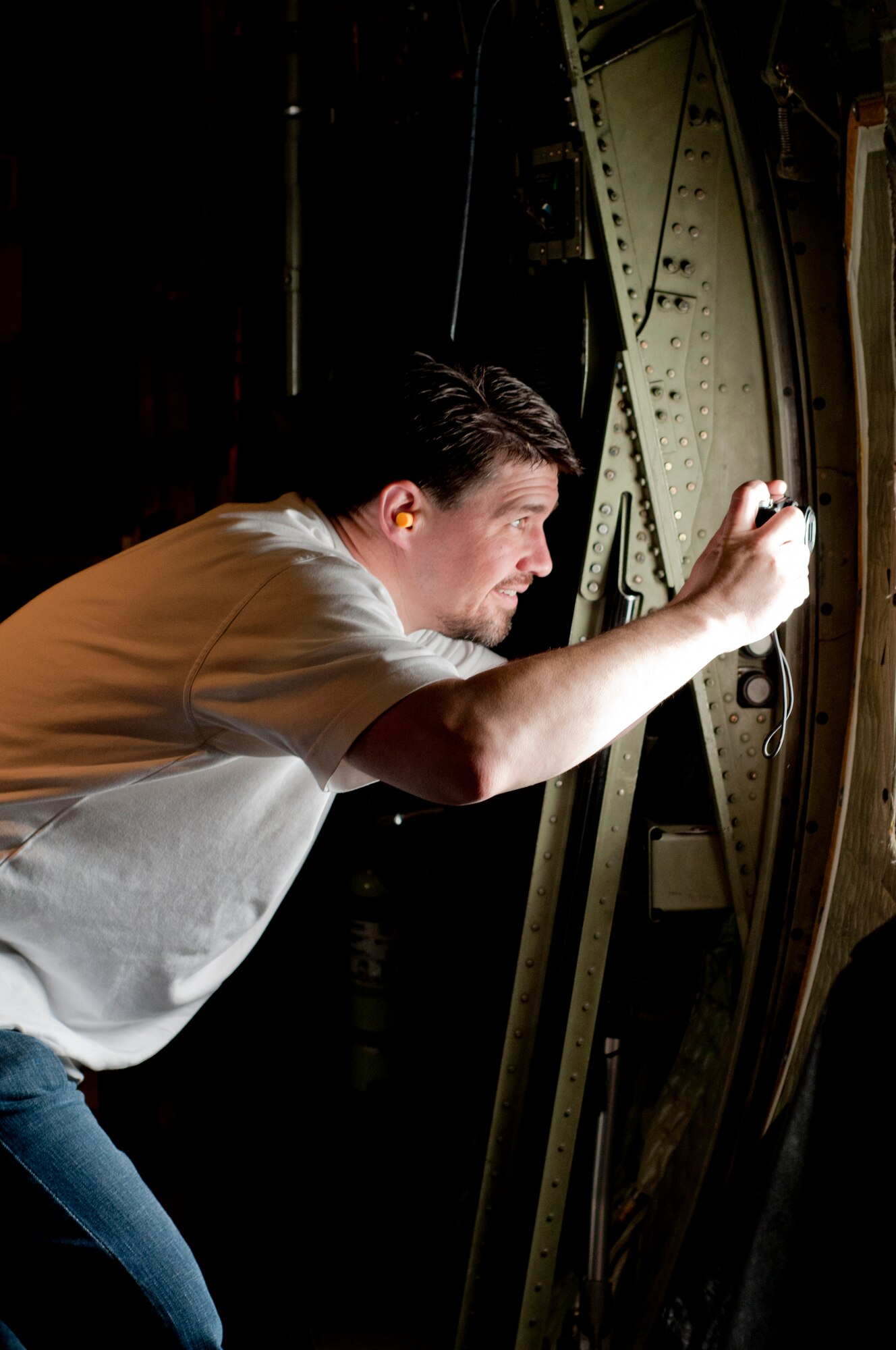 An area educator examines the view from a C-130. The 910th Airlift Wing hosted approximately 20 local teachers, principals, school administrators and other school workers for an educator’s flight and base tour Friday. Educators learned about opportunities with the Air Force Reserve for their students through the experience, which included briefings by base leadership and recruiters. 