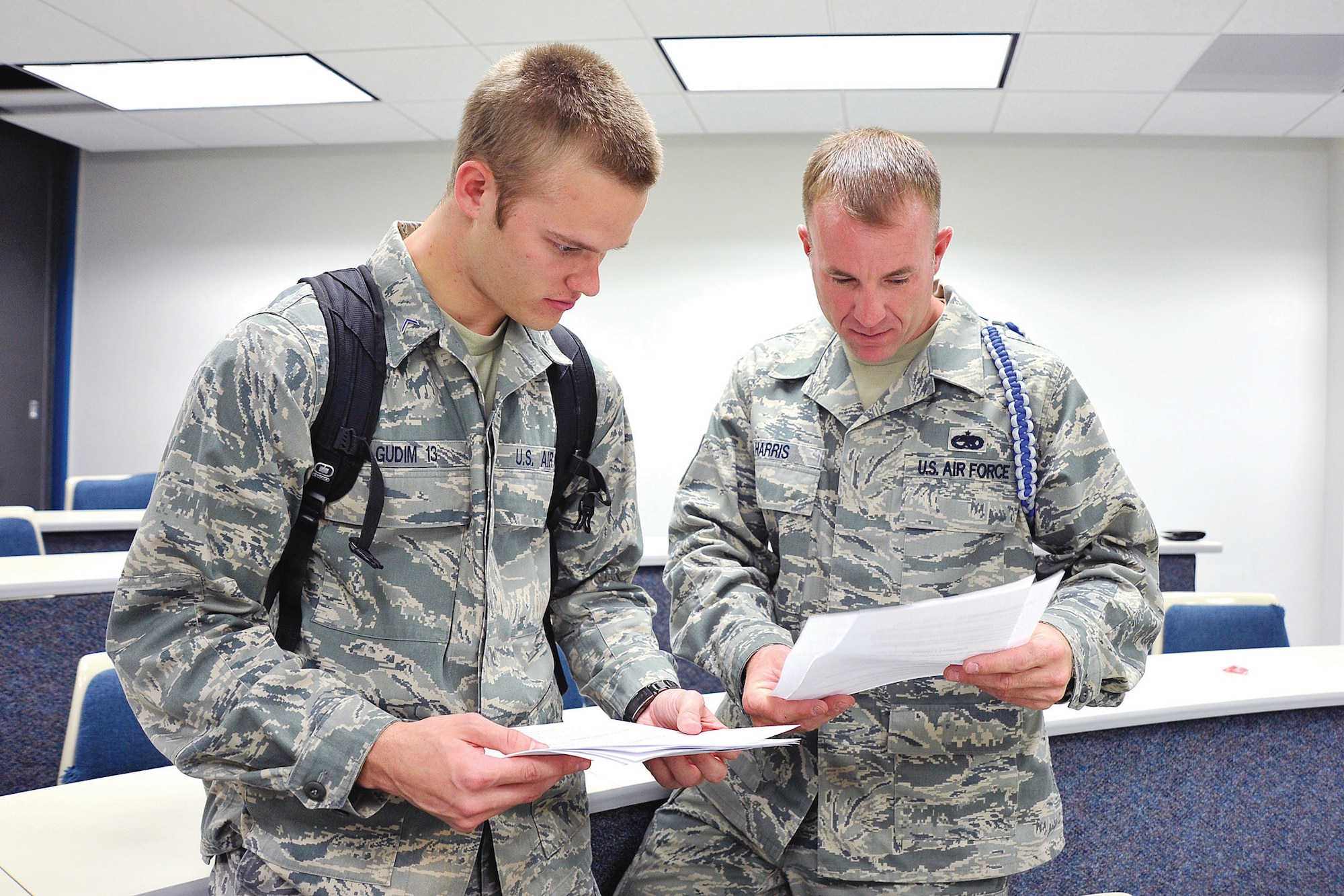 Master Sgt. Scott Harris, an Academy Military Training NCO with Cadet Squadron 32, goes over test results with Cadet 3rd Class Brett Gudem, Cadet Squadron 32.(U.S. Air Force photo by Mike Kaplan)
