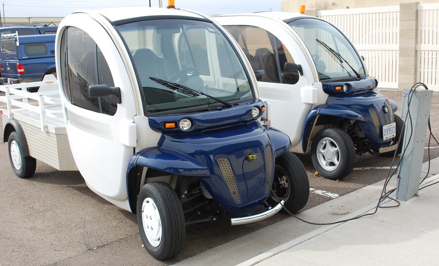 Two of the 14 electric vehicles currently in use at Malmstrom Air Force Base are parked outside the 341st Civil Engineer Squadron's Environmental Flight. (U.S. Air Force photo/Valeire Mullett)