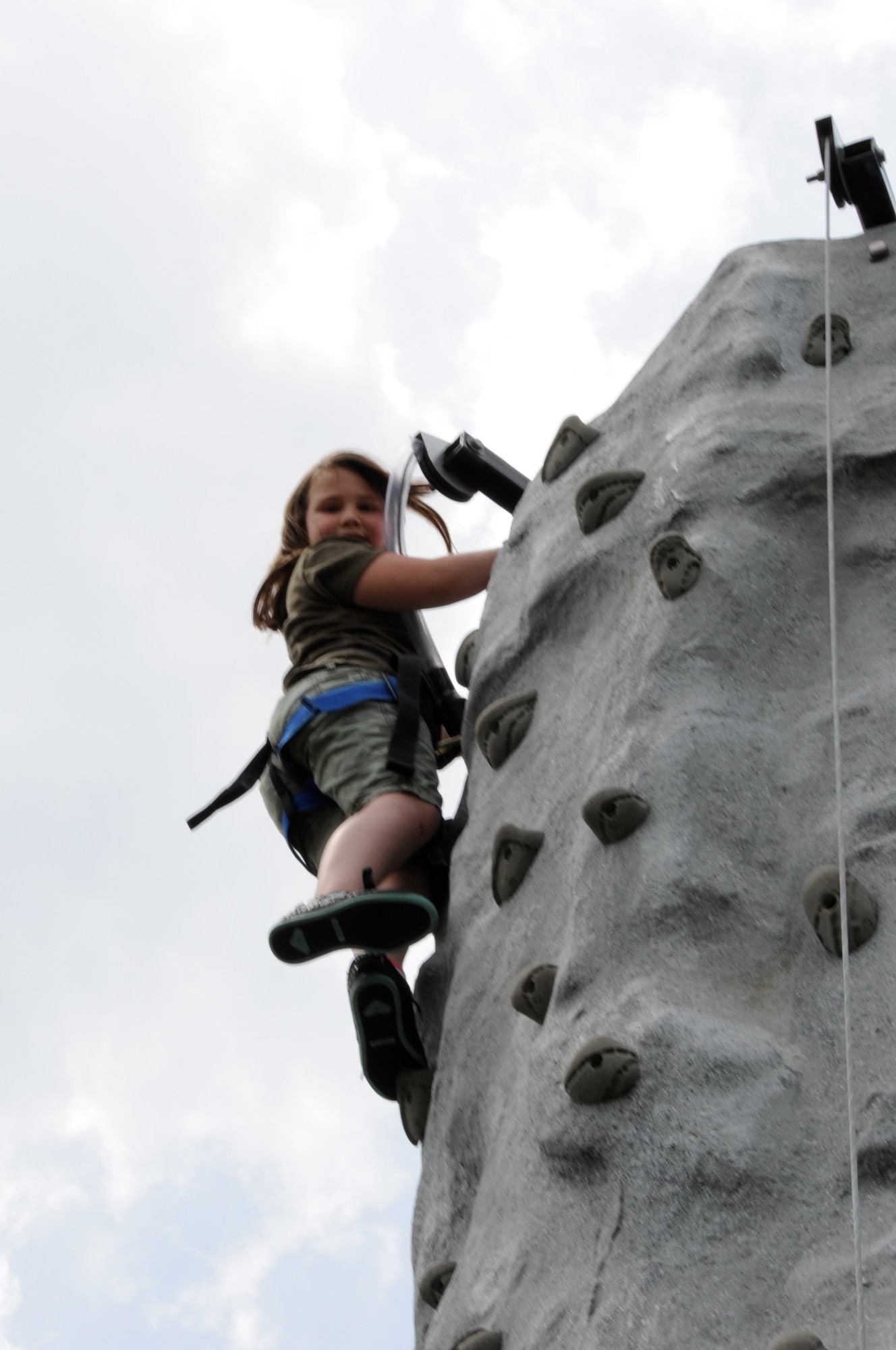 Ain’t no mountain high enough! Lindsey Every-Clayton, 8, smiles after scaling the 25 foot rock wall during the Joint Base McGuire-Dix-Lakehurst Family Fun Fest, April 27. More than 1,000 members of the community attended this years’ fun fest. (U.S. Air Force photo by Pascual Flores/Released)