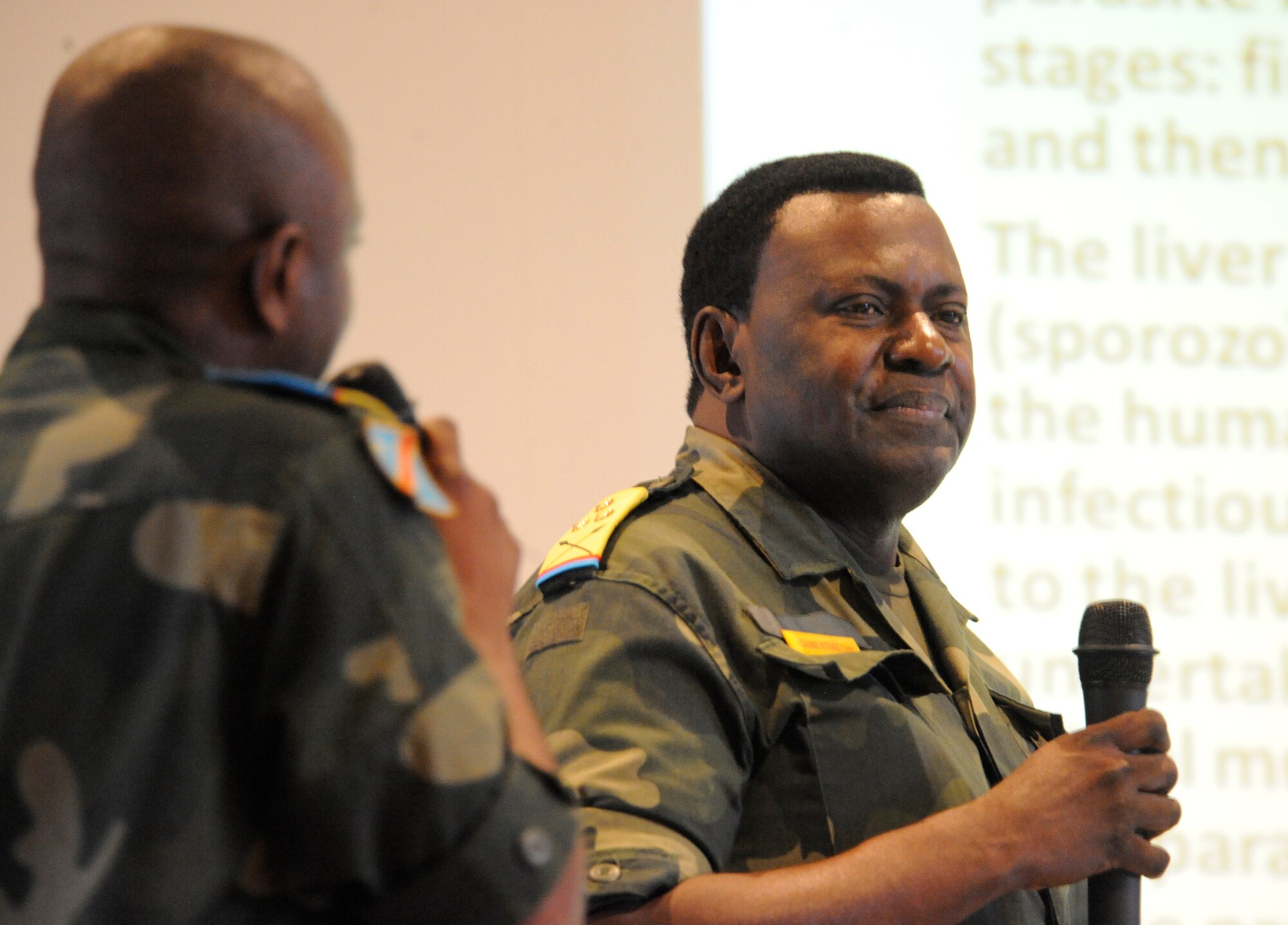 KINSHASA, Democratic Repulic of Congo -- Congolese Col. Omer Djembe Kitenge, coordinator of the fight against malaria for the DRC military, answers questions from U.S. military members during a Congolesian lead training at the Centre Superior Militiare Academy here April 28, 2011 as part of MEDLITE 11. MEDLITE 11 is a joint medical exercise focused on aeromedical evacuation, to improve the readiness of U.S. Air Force and DRC personnel. (U.S. Air Force photo by Tech. Sgt. Todd Wivell)