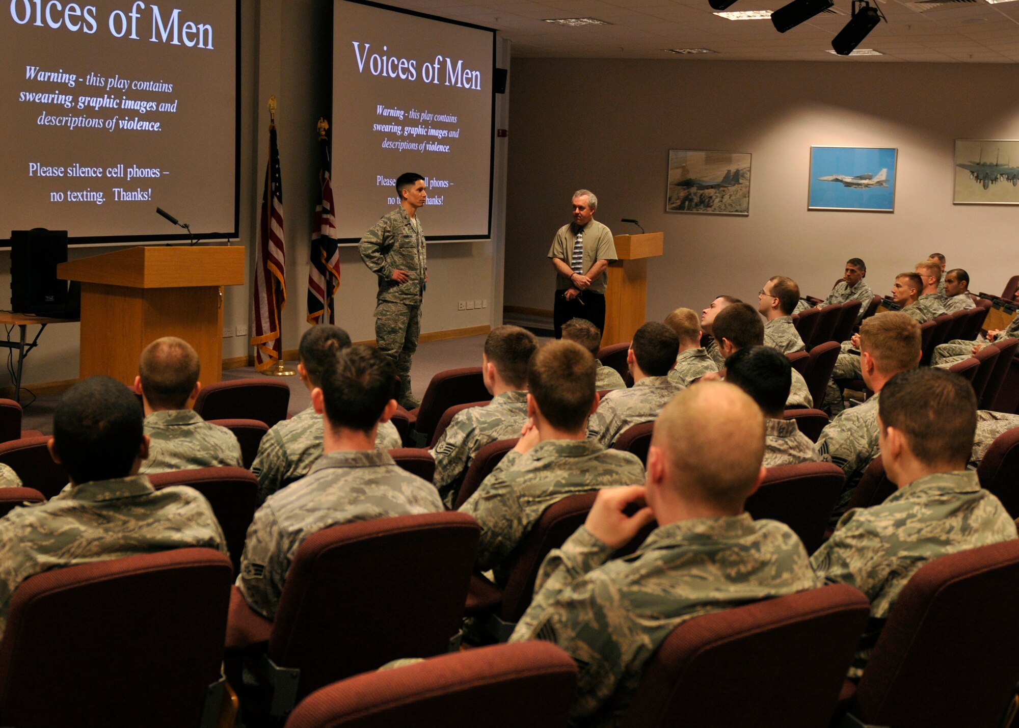 ROYAL AIR FORCE LAKENHEATH, England Col. John Quintas, 48th Fighter Wing commander, (left), introduces sexual assault awareness activist Ben Atherton-Zeman for his one-man play "Voices of Men" at the Strike Eagle Complex on April 27, 2011. Mr. Atherton-Zeman uses humor, video clips, and celebrity male voice impersonations to educate the audience on sexual assault, abuse and how to stop it from happening. (U.S. Air Force photo/Senior Airman Tiffany M. Deuel)