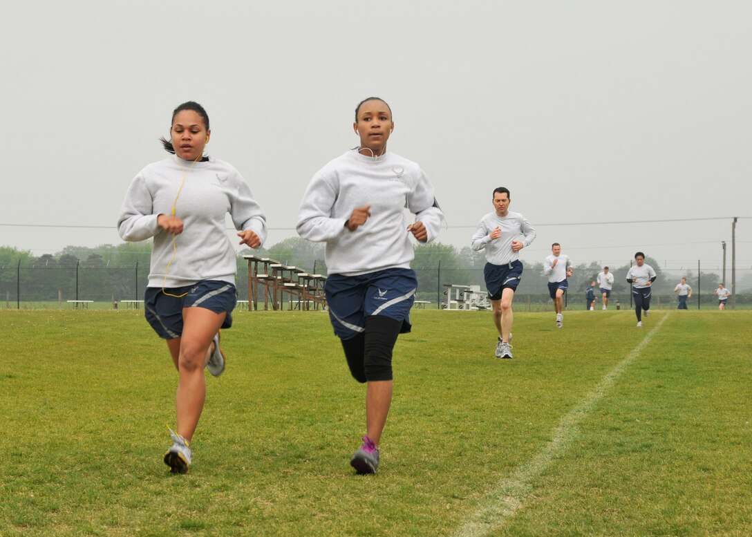 ROYAL AIR FORCE LAKENHEATH, England Airmen run a 5k ending at the softball field to kick-off Wing Sports Day on April 29, 2011. The day offered a multitude of sporting events to include soccer, softball and sumo-wrestling to raise money for the Top 3. The Top 3 is an organization that funds several events on the base throughout the year, varying from awards banquets to induction ceremonies. (U.S. Air Force photo/Senior Airman Tiffany M. Deuel)