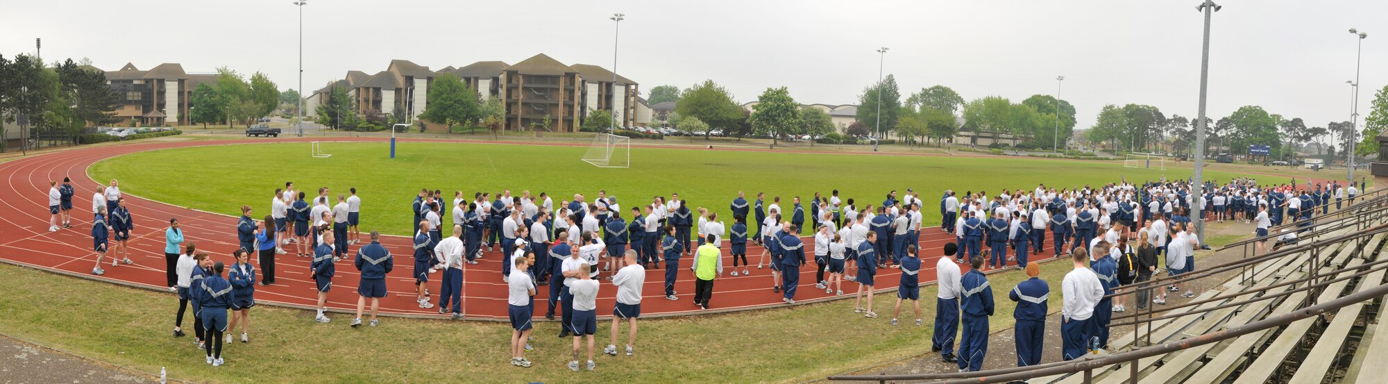 ROYAL AIR FORCE LAKENHEATH, England 48th Fighter Wing Airmen and families gather for the fun run to kick off the 48th FW Sports Day at the base track on April 29, 2011. The day consisted of competitive sports, food, fun and fundraising. Money raised will be used to support events varying from awards banquets to induction ceremonies. (U.S. Air Force photo illustration/Senior Airman Tiffany M. Deuel)