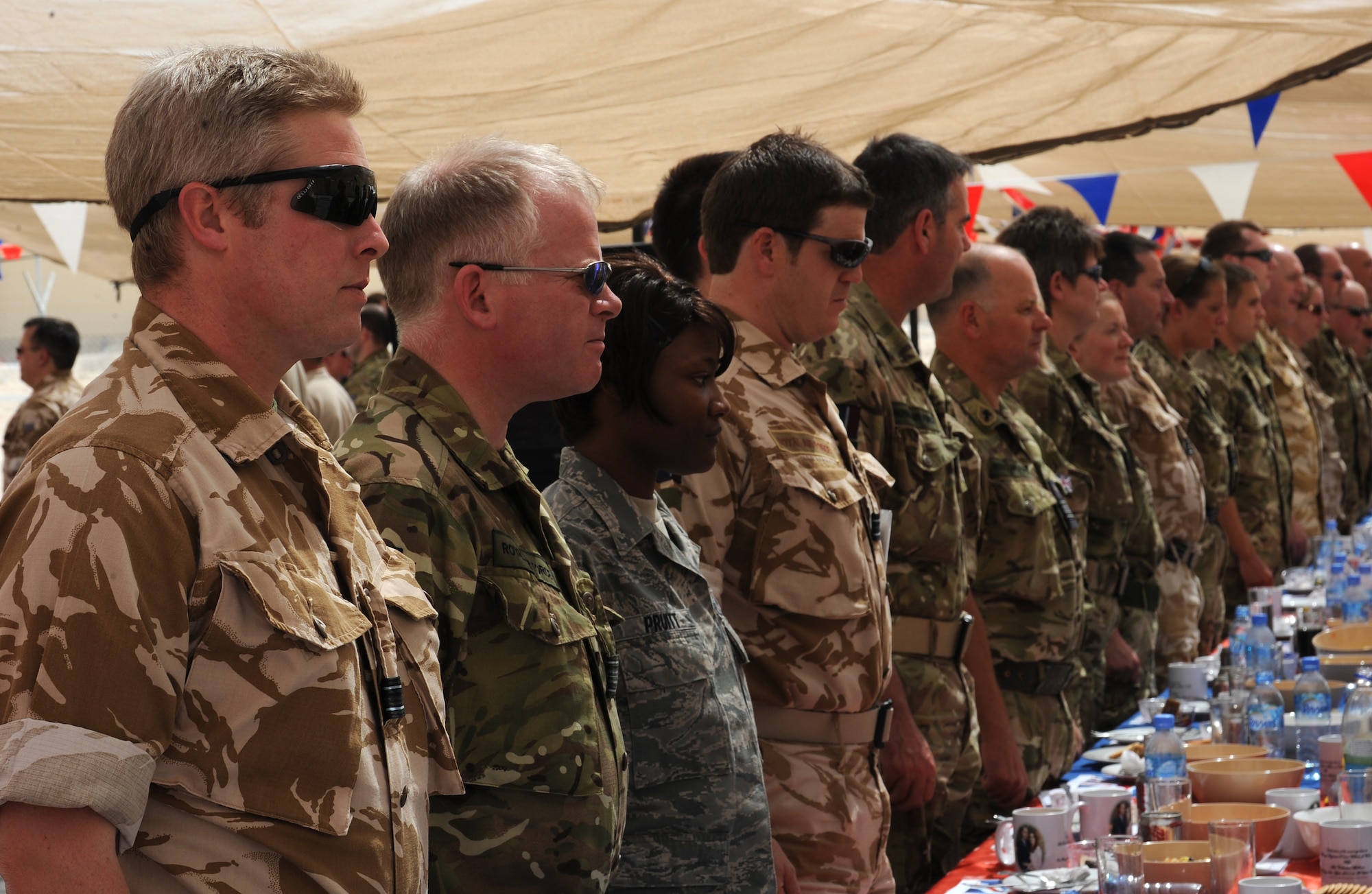 British and American service members get together to celebrate the royal wedding with a traditional street party while deployed in Southwest Asia, April 29. Street parties are a tradition which has been linked with royal and other national events for a century. (U.S. Air Force photo/Staff Sgt. Liliana Moreno)                                         