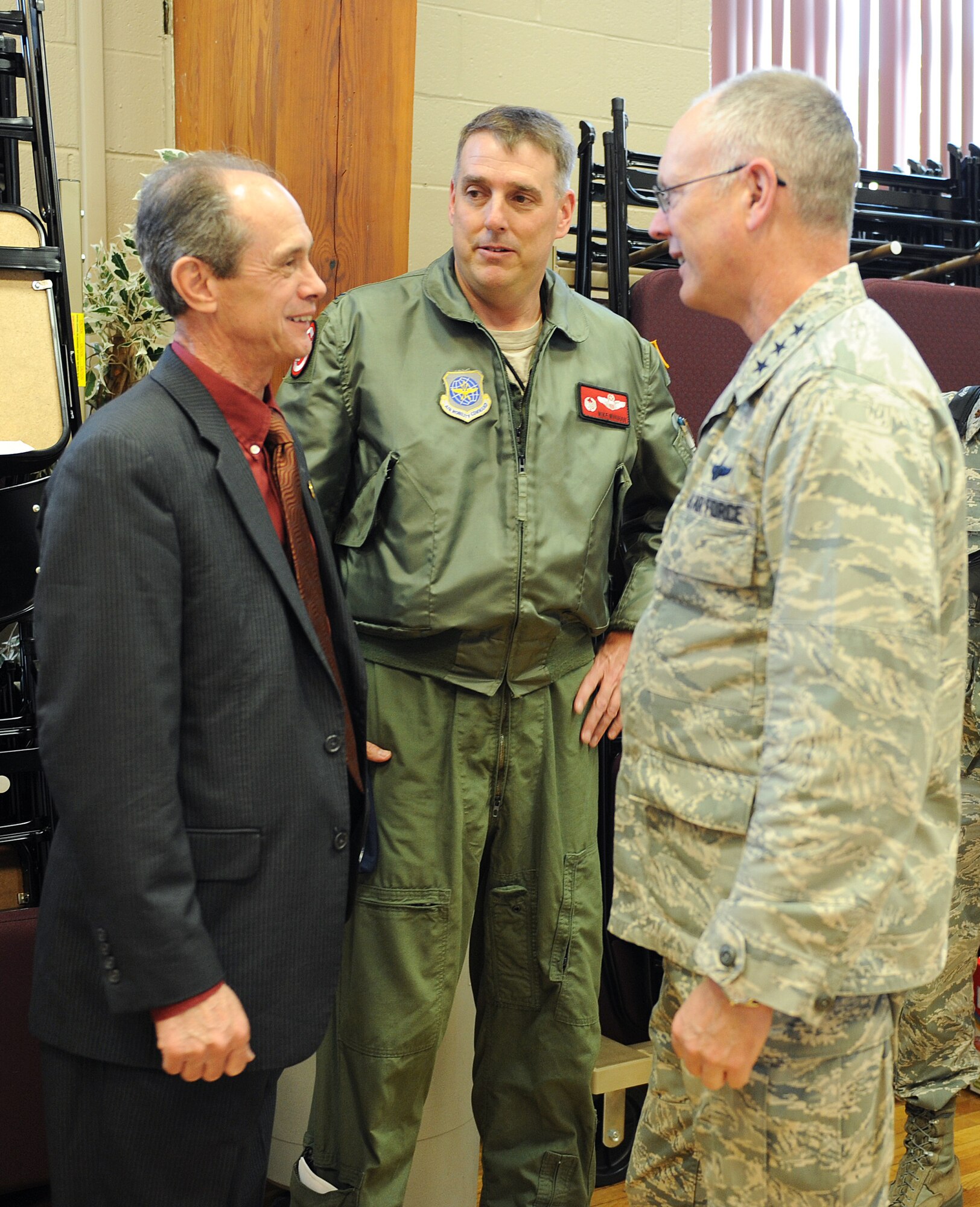 Lt. Gen. Robert Allardice, 18th Air Force commander, talks with Jacksonville Mayor Gary Fletcher April 28, 2011, at Little Rock Air Force Base, Ark. Mayor Fletcher explained to General Allardice how the local community was helping Airmen to recover after a tornado struck the base April 25. (U. S. Air Force photo by Airman 1st Class Ellora Stewart)