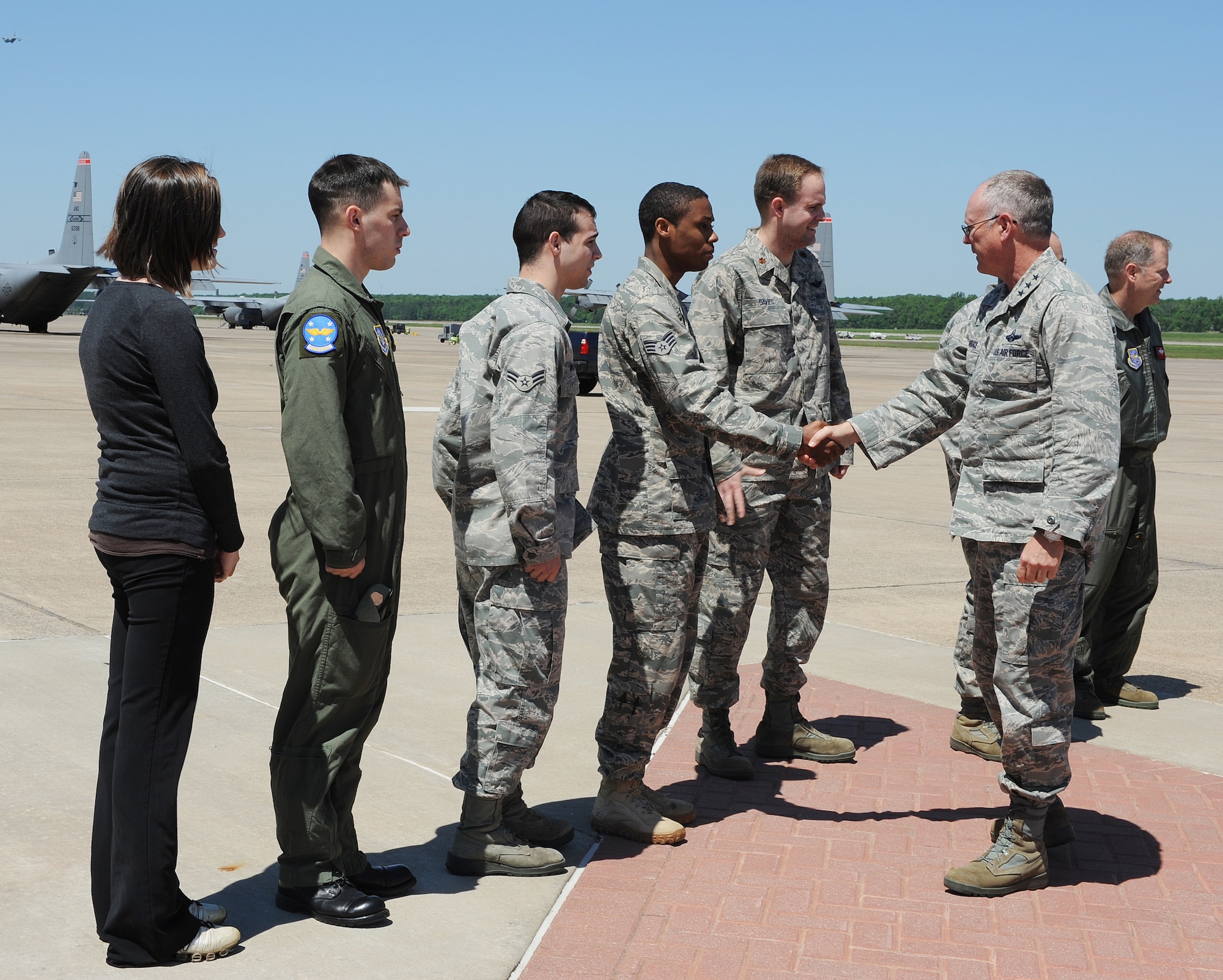 Lt. Gen. Robert Allardice, 18th Air Force commander, greets Airmen on the flightline at Little Rock Air Force Base, Ark., April 28, 2011. The Airmen discussed their participation in recovery efforts after a tornado struck the base April 25. (U. S. Air Force photo by Airman 1st Class Ellora Stewart)