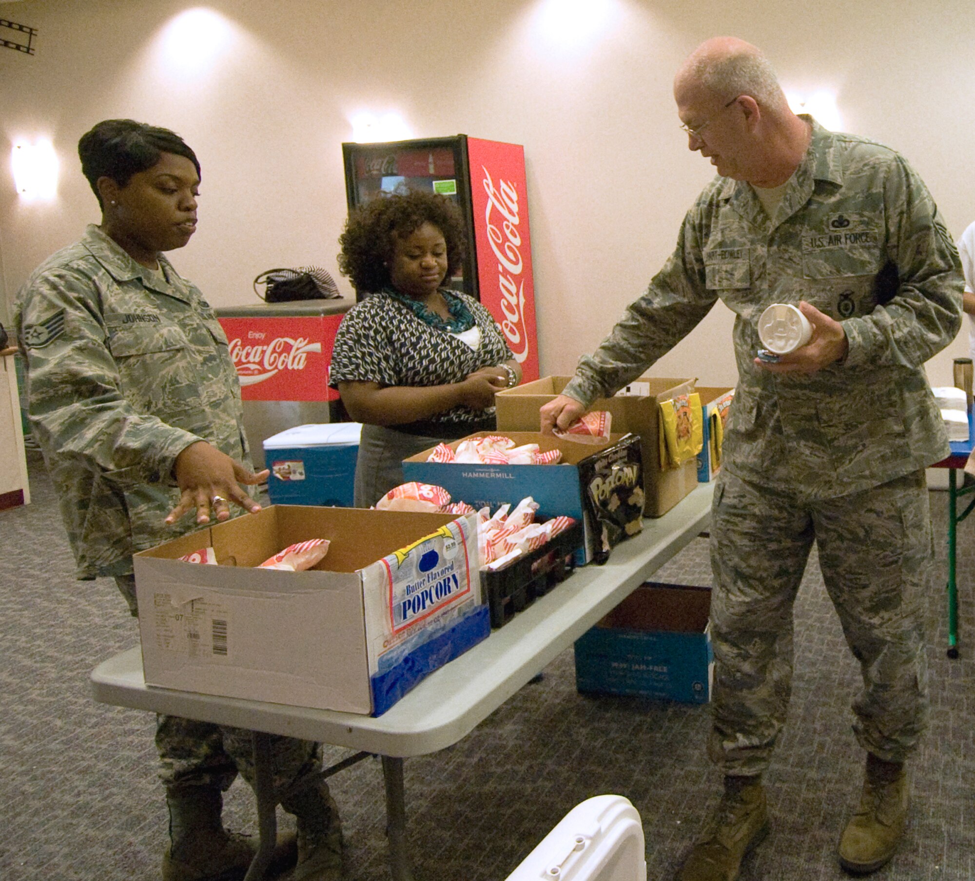 Master Sgt. Joseph Hart-Bowley, Air Force District of Washington Reserve Affairs, selects his snacks for the AFDW Wingman Culture Club event held April 20 at  the Joint Base Andrews, Md. base theatre. The combined Unit Compliance Inspection review and Wingman Culture Club sponsored film screening featured the 1961 drama "A Gathering Of Eagles," which followed a Strategic Air Command Wing as it was inspected. AFDW Headquarters Staff will undergo a UCI in 33 days. AFDW units also overlooked initial reports on cross-functional reviews designed to simulate the inspection. (U.S. Air Force Photo by Bobby Jones)