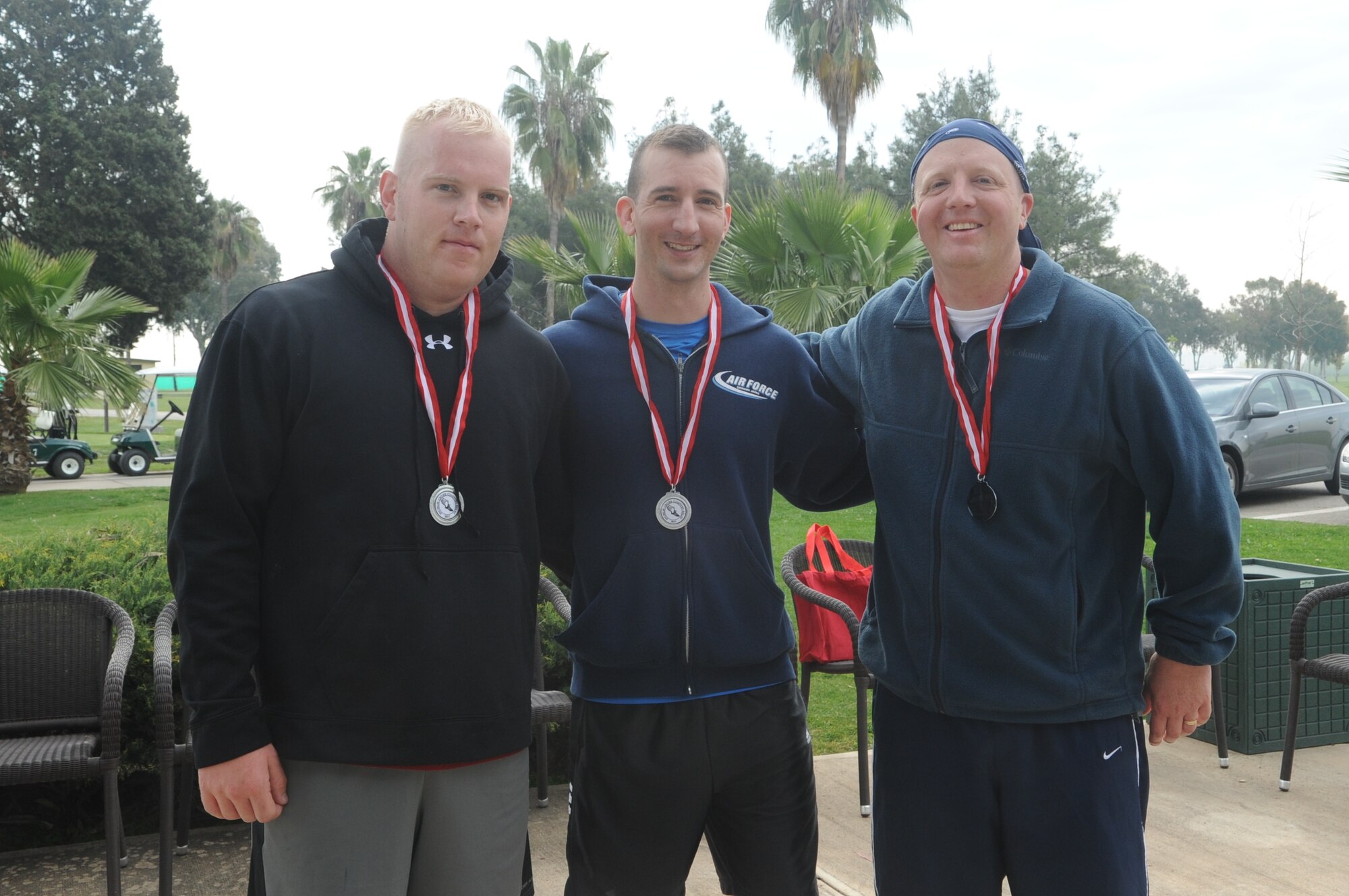 Staff Sgts. Justin Alexander and Michael Gonzalez and Tech. Sgt. Thomas Bohl, all from the 39th Civil Engineer Squadron, pose for a team photo after participating in “Run to Read,” a 4.2 mile cross-country relay race at Incirlik Air Base, Turkey April 16, 2011. Each relay team consisted of three people and each team member was required to run a 1.4 mile leg of the race.  The purpose of the relay race was to offer the Incirlik community a diverse exercise challenge and promote teamwork.  (U.S. Air Force photo by Tech. Sgt. Valda Wilson/Released)