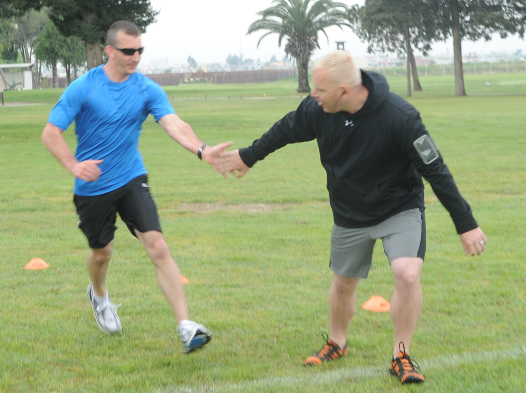 Staff Sgts. Justin Alexander and Michael Gonzalez, both from the 39th Civil Engineer Squadron, participate in “Run to Read,” a 4.2 mile cross-country relay race at Incirlik Air Base, Turkey April 16, 2011. Each relay team consisted of three people and each team member was required to run a 1.4 mile leg of the race.  The purpose of the relay race was to offer the Incirlik community a diverse exercise challenge and promote teamwork.  (U.S. Air Force photo by Tech. Sgt. Valda Wilson/Released)
