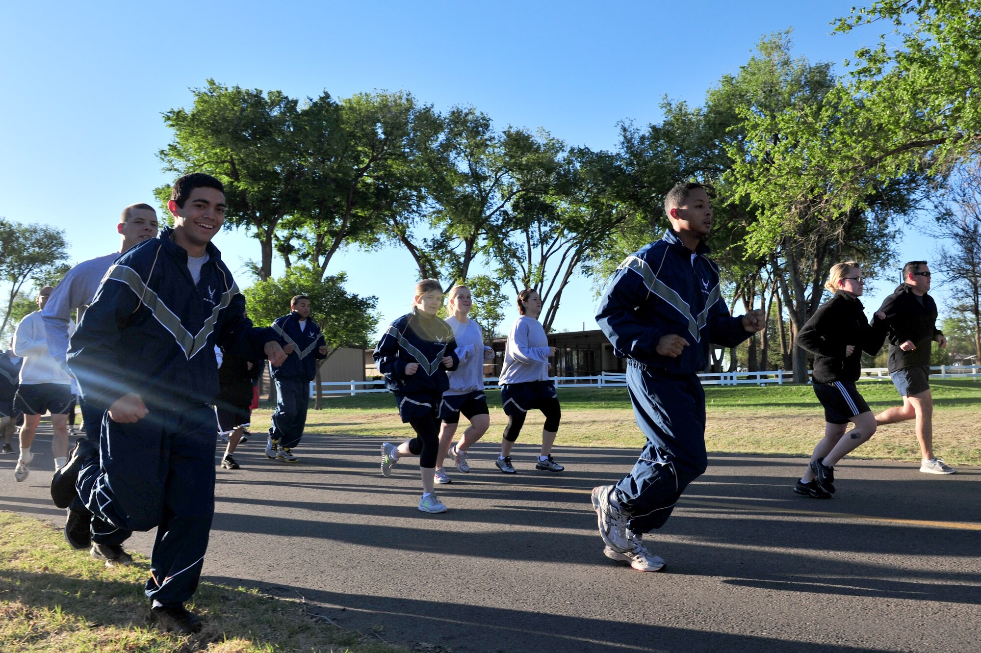 Participants take the first few steps of a 5K fun run as the sun rises on Cannon Air Force Base, N.M., April 28, 2011. The run was organized in support of Earth Day, Arbor Day and Sexual Assault Awareness Month. (U.S. Air Force photo by Tech. Sgt. Josef Cole)(RELEASED)
