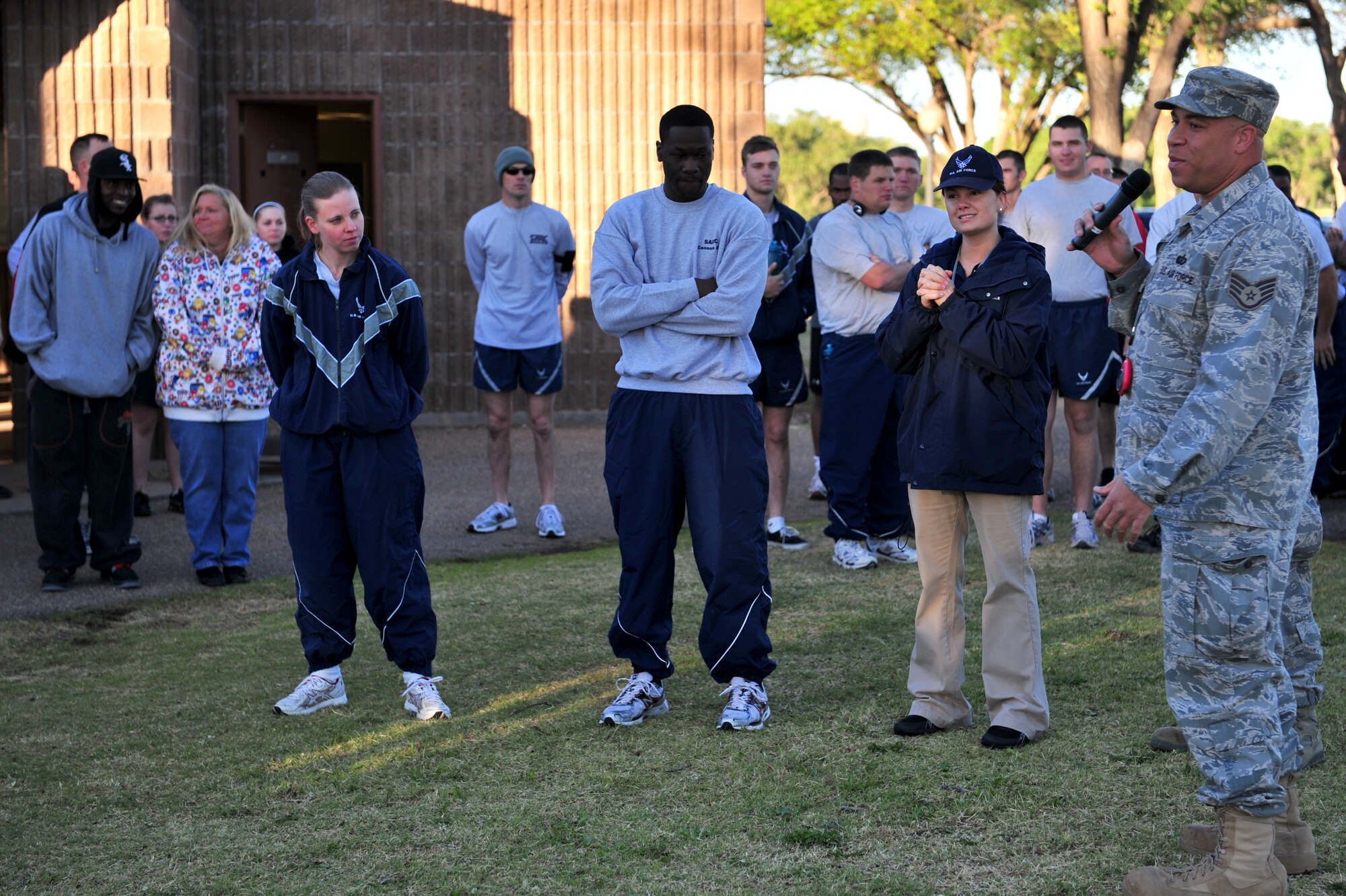 Participants receive a safety briefing and pep talk from Staff Sgt. Freddie Jones, 27th Special Operations Services Squadron, prior to the start of a 5K fun run as the sun rises on Cannon Air Force Base, N.M., April 28, 2011. The run was organized in support of Earth Day, Arbor Day and Sexual Assault Awareness Month. (U.S. Air Force photo by Tech. Sgt. Josef Cole)(RELEASED)
