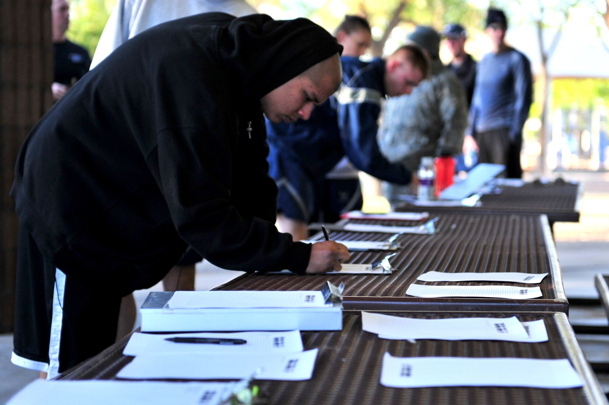 Participants in a 5K fun run sign up before the event April 28, 2011 at Cannon Air Force Base, N.M. The run was organized in support of Earth Day, Arbor Day and Sexual Assault Awareness Month.  (U.S. Air Force photo by Tech. Sgt. Josef Cole)(RELEASED)