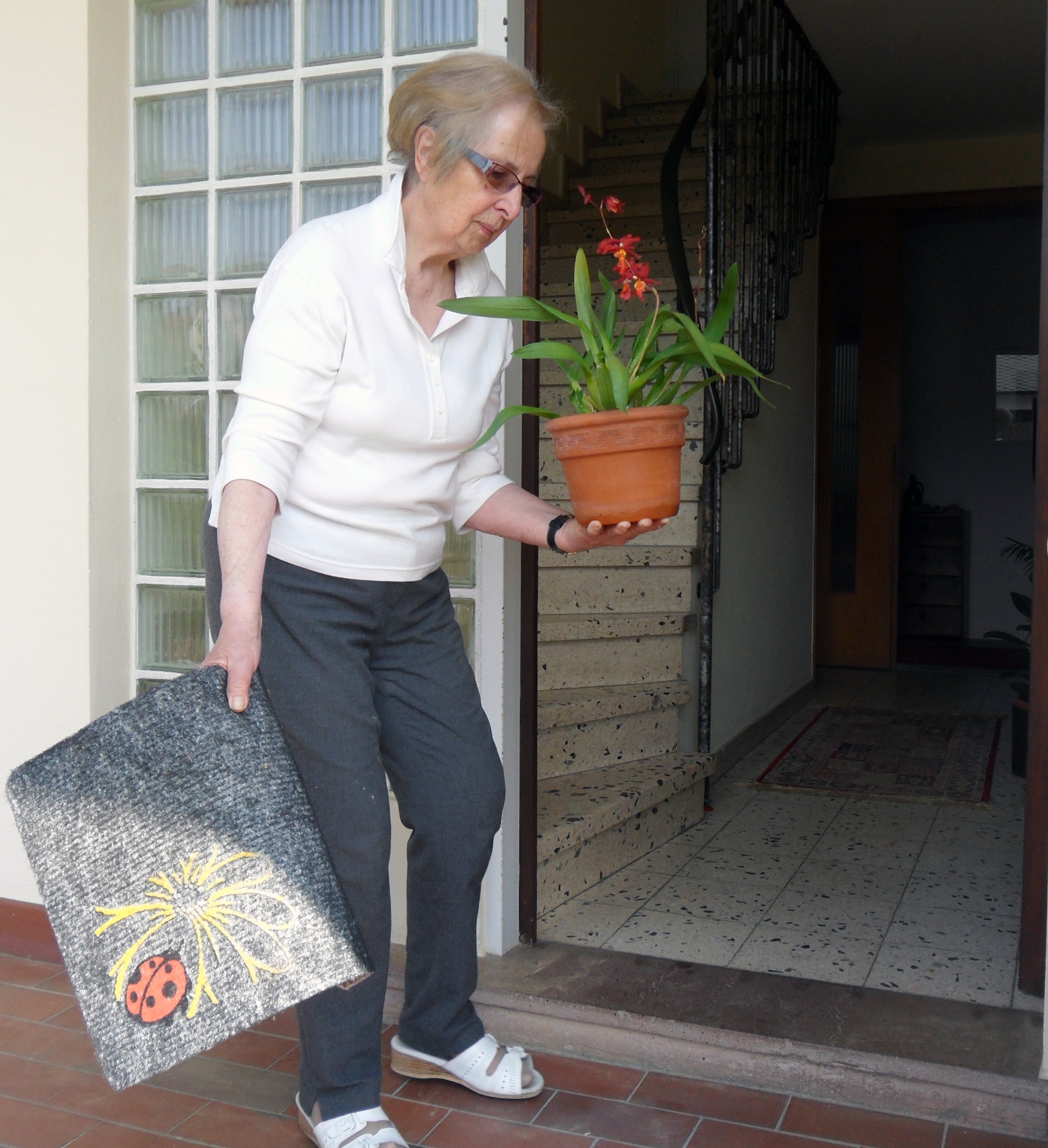 SPANGDAHLEM AIR BASE, Germany –A German woman moves items inside the house prior to witches’ night April 30. It is a tradition in Germany that youngsters in town make things disappear from one spot and appear somewhere else that evening.  Witches’ night is celebrated before German Labor Day. (U.S. Air Force photo/Iris Reiff)
