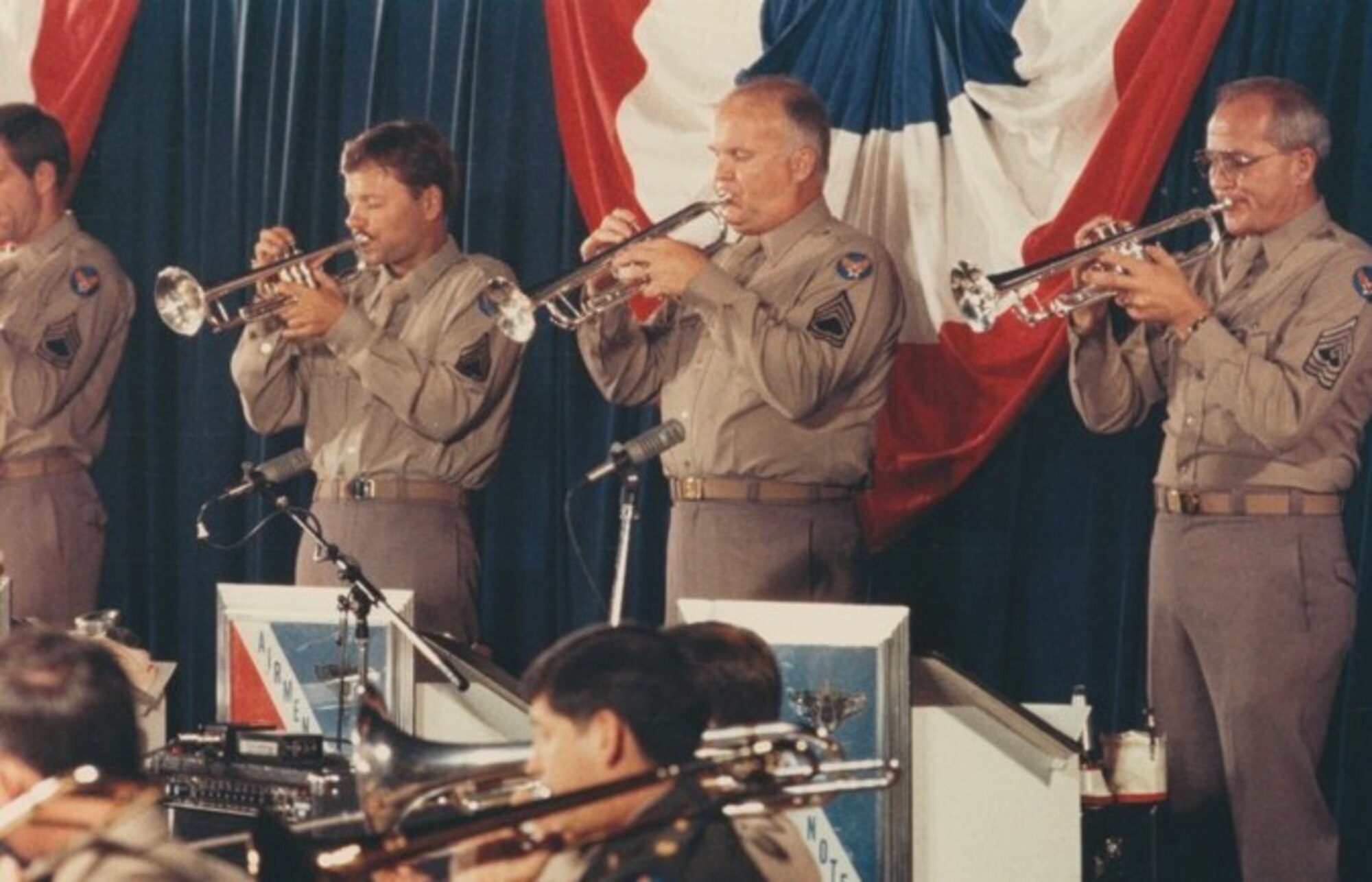 Airmen of Note Trumpeters Kenny Smukal, Vaughn Nark, Jimmy Lay, Lawrence Trautman perform a Glenn Miller show in their “Pinks and Greens” uniforms. If you have any additional information about this photograph you’d like to share, please email our Band Historian <a href="mailto:usafbandhistorian@afncr.af.mil">Tech. Sgt. Tracey MacDonald</a>. Thank you and we look forward to hearing from you!  This is Photo 45. (Unknown Photographer)