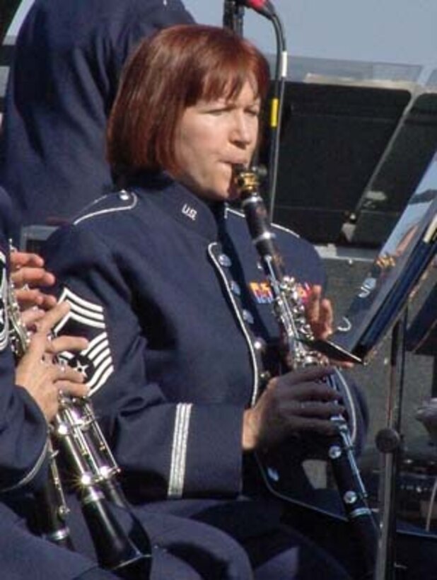 Chief Master Sgt. Elizabeth Schouten, Superintendent for The United States Air Force Band, will retire this spring, after 30 years of service in the Air Force.  She is seen here performing on B flat Clarinet at the Air Force Memorial on 14 Oct 2007 under the direction of former Commander Col. Dennis Layendecker.