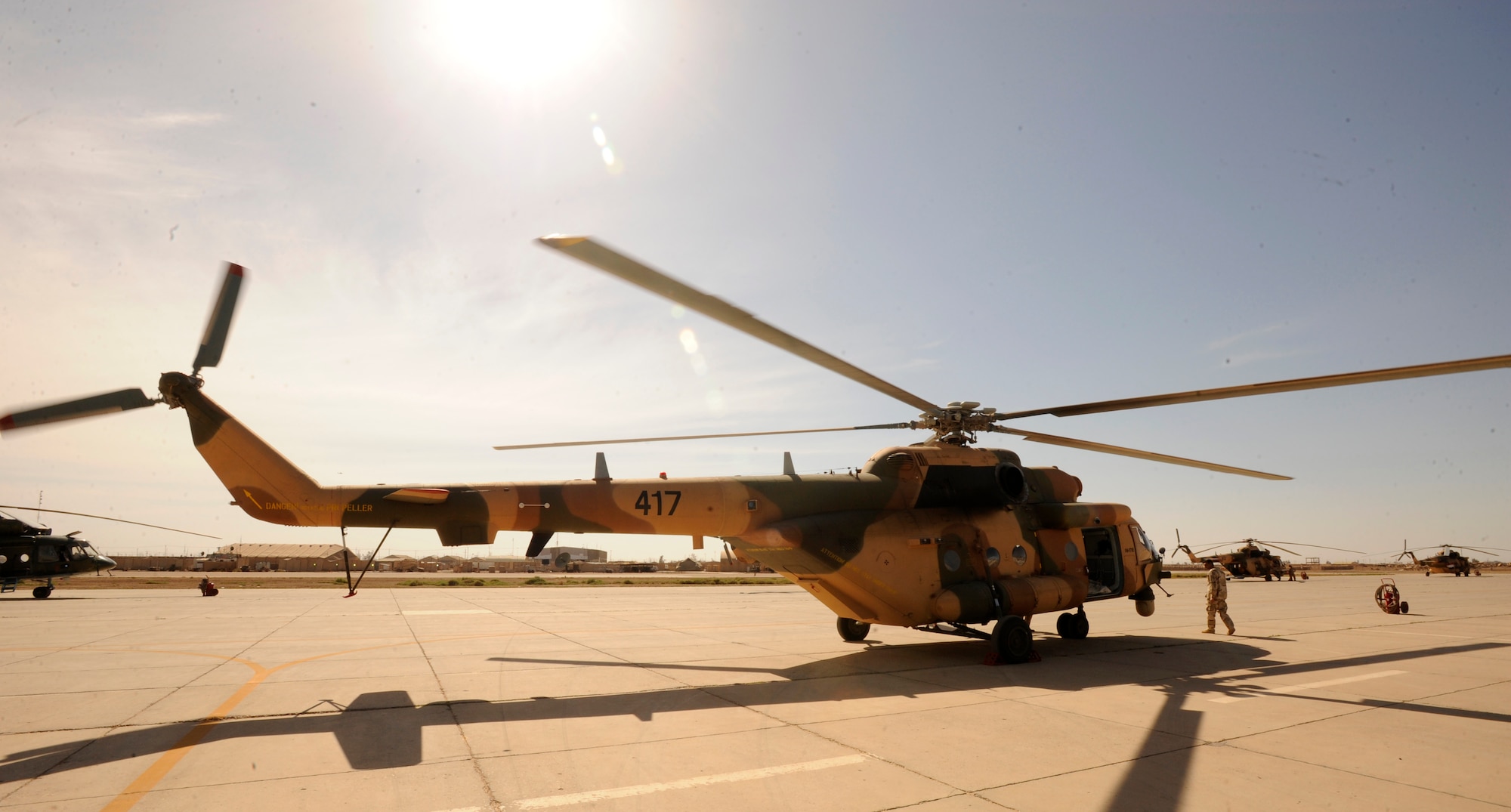 CAMP TAJI, Iraq -- An Iraqi Mi-171E helicopter taxis on the ramp as contractors delivered two helicopters to Iraqi Army Aviation Command April 27. More than 30 Iraq Training and Advisory Mission - Air advisors train their Iraqi partners how to fly, maintain and employ the Mi-171E helicopters for various missions, including joint counterterrorism operations with the Iraq Counter-Terrorism Bureau.  (U.S. Air Force/Tech. Sgt. Jason Lake)