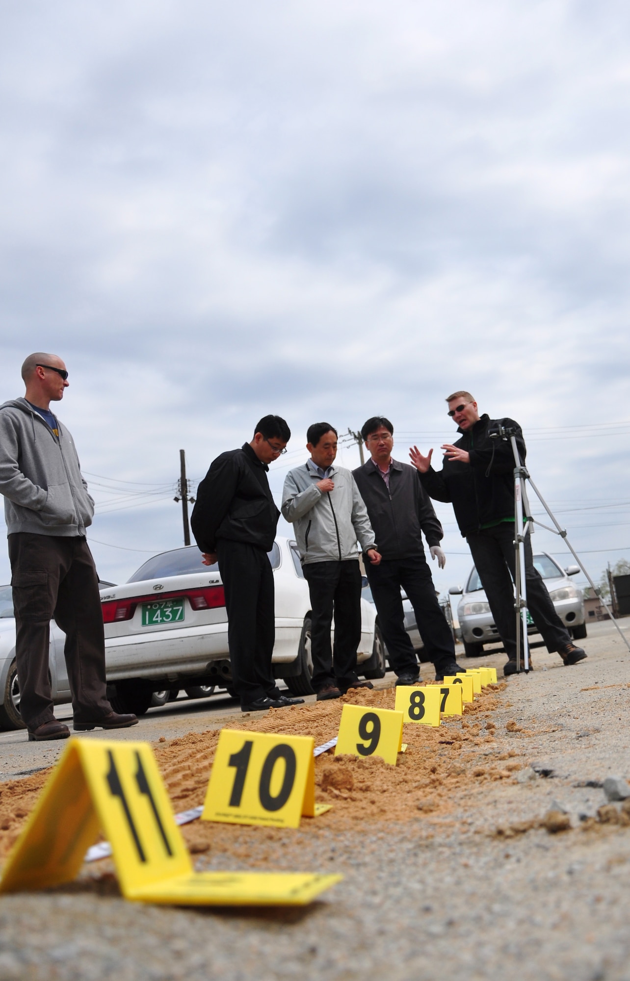 Proper procedures when photographing and molding tire imprints were among the forensic procedures that were discussed here April 29. Osan’s AFOSI detachment took a recent opportunity to not only practice their own abilities but also teach and learn from local Republic of Korea air force members and Korean police investigators. The training included numerous crime scene investigation forensic techniques. (U.S. Air Force photo/Staff Sgt. Chad Thompson)