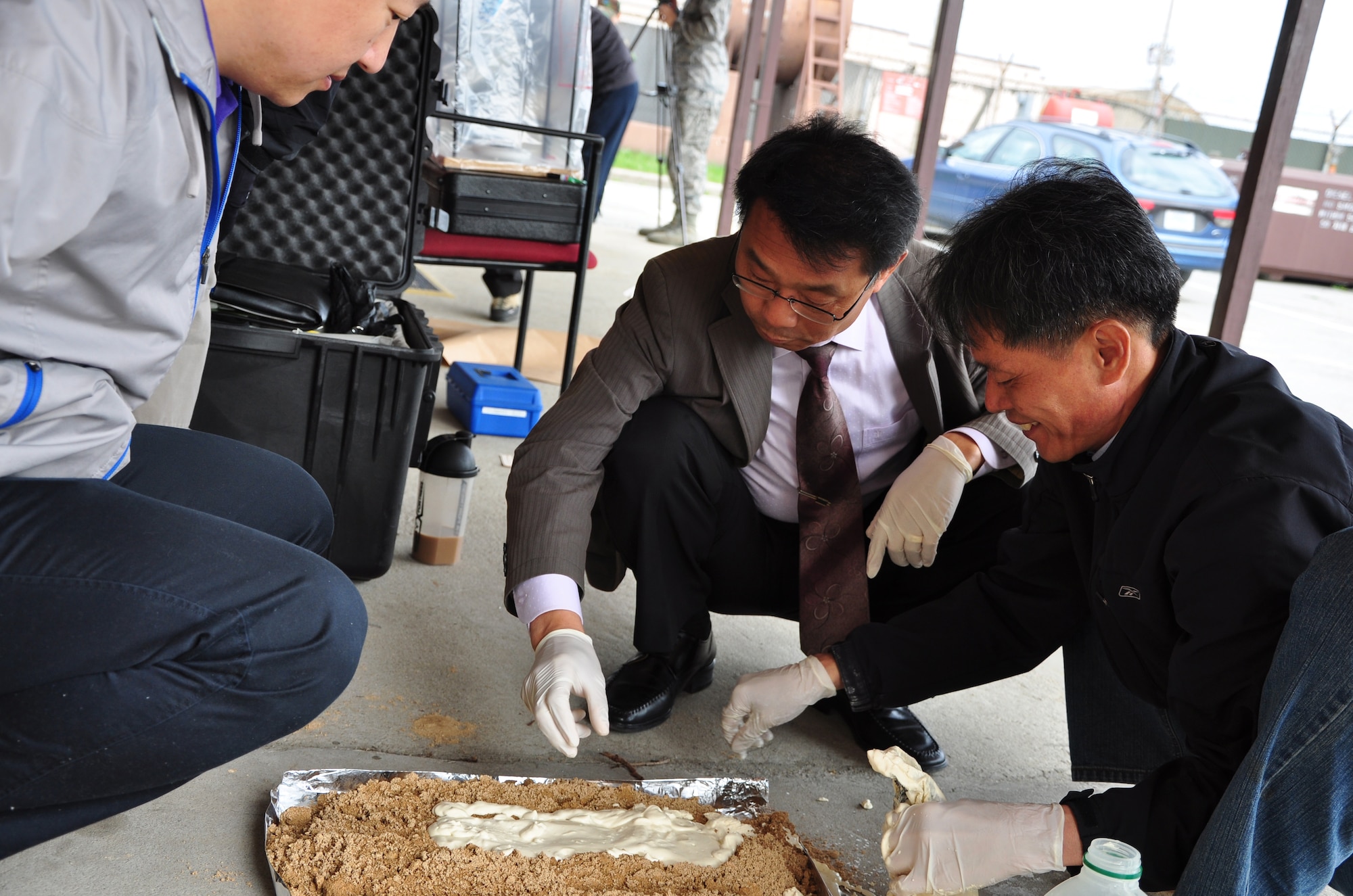 Proper procedures when photographing and molding shoe imprints were among the forensic procedures that were discussed here April 29. Osan’s AFOSI detachment took a recent opportunity to not only practice their own abilities but also teach and learn from local Republic of Korea air force members and Korean police investigators. The training included numerous crime scene investigation forensic techniques. (U.S. Air Force photo/Staff Sgt. Chad Thompson)