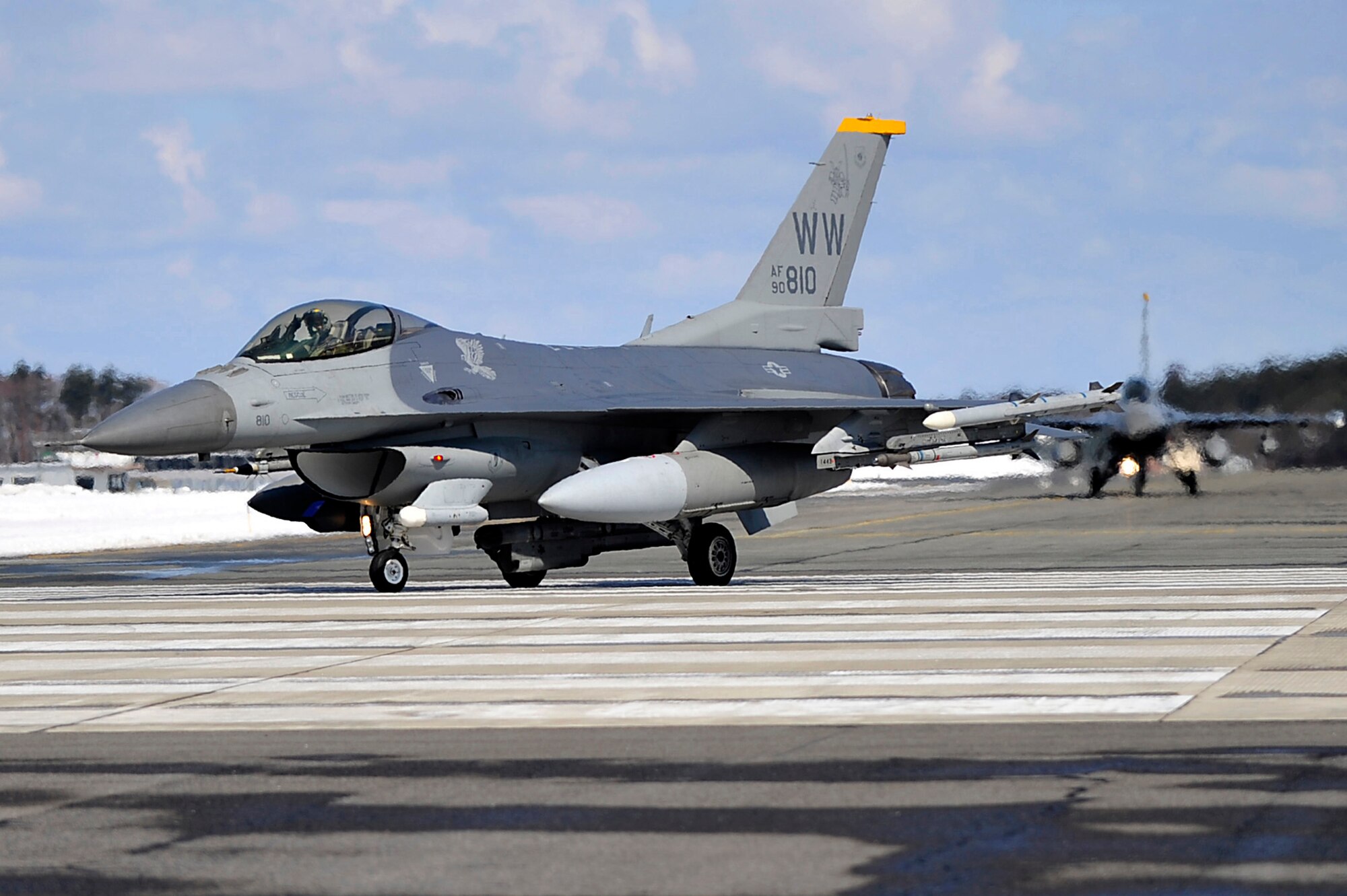 MISAWA AIR BASE, Japan -- A pilot from the 14th Fighter Squadron signals the customary horns of the Samari hand sign as he taxis for take off Mar. 27.  The March 11 earthquake had little effect on military flight operations at Misawa. (U.S. Air Force photo/Staff Sgt. Marie Brown)