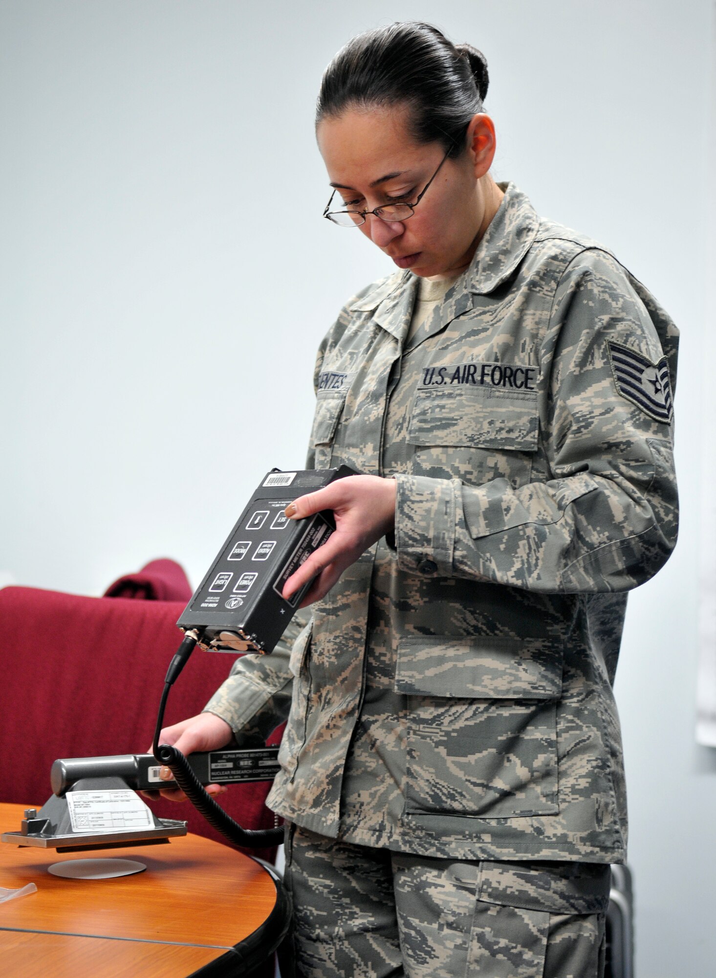 MISAWA AIR BASE, Japan – Tech. Sgt. Vanessa Cifuentes, 673rd Aerospace Medicine Squadron, bioenvironmental technician, scans filter paper removed from a high-volume air sampler at Misawa Air Base April 29. Bioenvironmental engineers have found no significant traces of radiation since the March 11 earthquake. Sergeant Cifuentes is augmenting the 35th AMDS and she is from Joint Base Elmendorf-Richardson, Alaska. (U.S. Air Force photo/Tech. Sgt. Phillip Butterfield)  