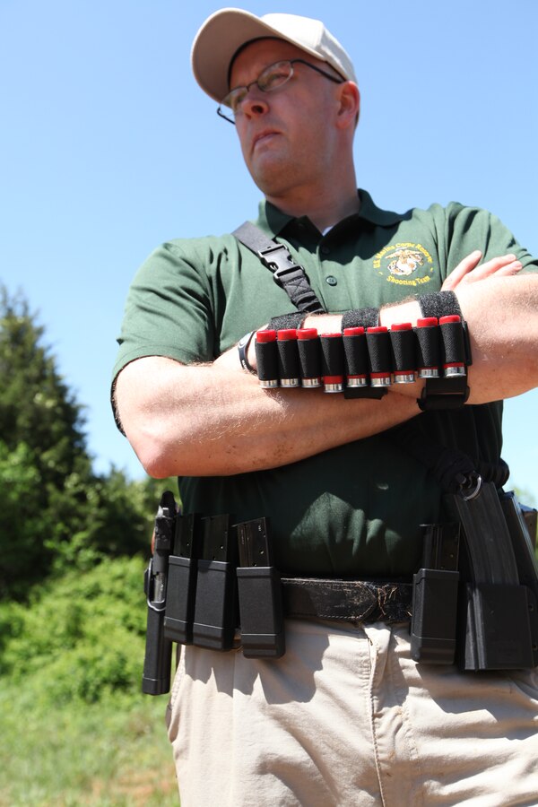 Chief Warrant Officer 3 Stephen G. Ryther, captain of the U.S. Marine Corps Reserve Pistol Shooting Team, awaits his turn to shoot in a three gun competition in Park City, Ky., April 30, 2011.  The team participates in various shoots in order to learn about different aspects of shooting so they can teach Marine Forces Reserve combat marksmanship trainers.