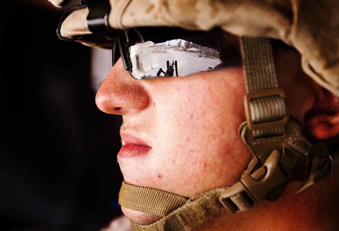 Pfc. Clark Kirkley, a native of Knoxville, Tenn., diligently scans his surroundings while standing post here, April 29. Kirkley, a member of 1st Battalion, 3rd Marine Regiment’s Guard Force Platoon, stands post and goes on patrols regularly as part of the guard force’s security responsibilities of the area. This is Kirkley’s first deployment. The battalion supports Regimental Combat Team 1, the Marine ground combat element in Southern Helmand province. The mission of the RCT is to partner with the Government of the Islamic Republic of Afghanistan to conduct counterinsurgency operations to secure the Afghan people, defeat insurgent forces, and enable Afghanistan to assume security responsibilities in the region. Ultimately, the partnered forces promote the expansion of stability, development and legitimate governance.