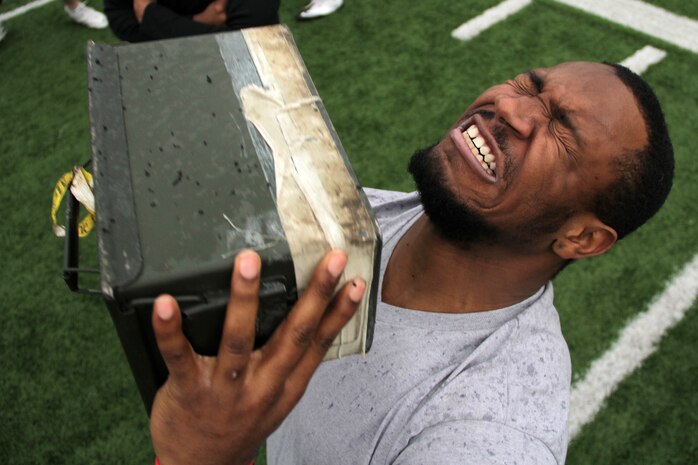Winona State Warrior running back Rayon Simmons knocks out one more ammo can lift before time runs out while taking a modified combat fitness test at Maxwell Field April 30. Simmons, a University City, Mo., native, is a junior at Winona State University. Mankato and Rochester recruiters proctored the modified combat fitness test. For more photos of the event, visit www.facebook.com/rstwincities.