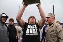 Sgt. Jonathan M. Rueppel, 25, from Yankton, S.D., motivates Winona State Warrior Tyler Kubler, a defensive end and redshirt freshman, during the ammo can lift portion of a modified combat fitness test at Maxwell Field April 30. Kubler, who graduated from Eden Prairie High School, completed 112 ammo can lifts in two minutes. Rueppel is a recruiter out of the Mankato, Minn., office. For more photos of the event, visit www.facebook.com/rstwincities.