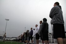 Staff Sgt. Jackie Culbertson, 33, from Griffin, Ga., briefs the Winona State University football team about the various events they'll face while taking a modified combat fitness test at Maxwell Field April 30. More than 40 of the Winona State Warriors participated in the event. Culbertson is the noncommissioned officer in charge of the Marine Corps recruiting substation in Rochester.