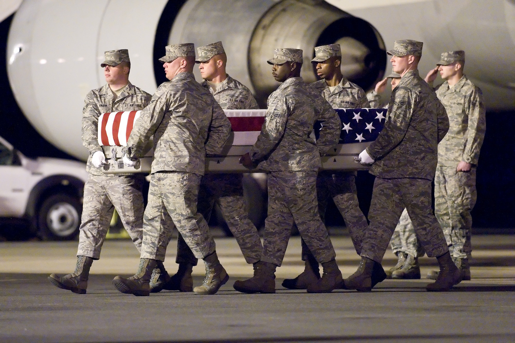 A U.S. Air Force carry team transfers the remains of Air Force Capt. Charles A. Ransom, of Midlothian, Va., at Dover Air Force Base, Del., April 30, 2011. Ransom was assigned to the 83rd Network Operations Squadron, Joint Base Langley-Eustis, Va. (U.S. Air Force photo/Roland Balik)