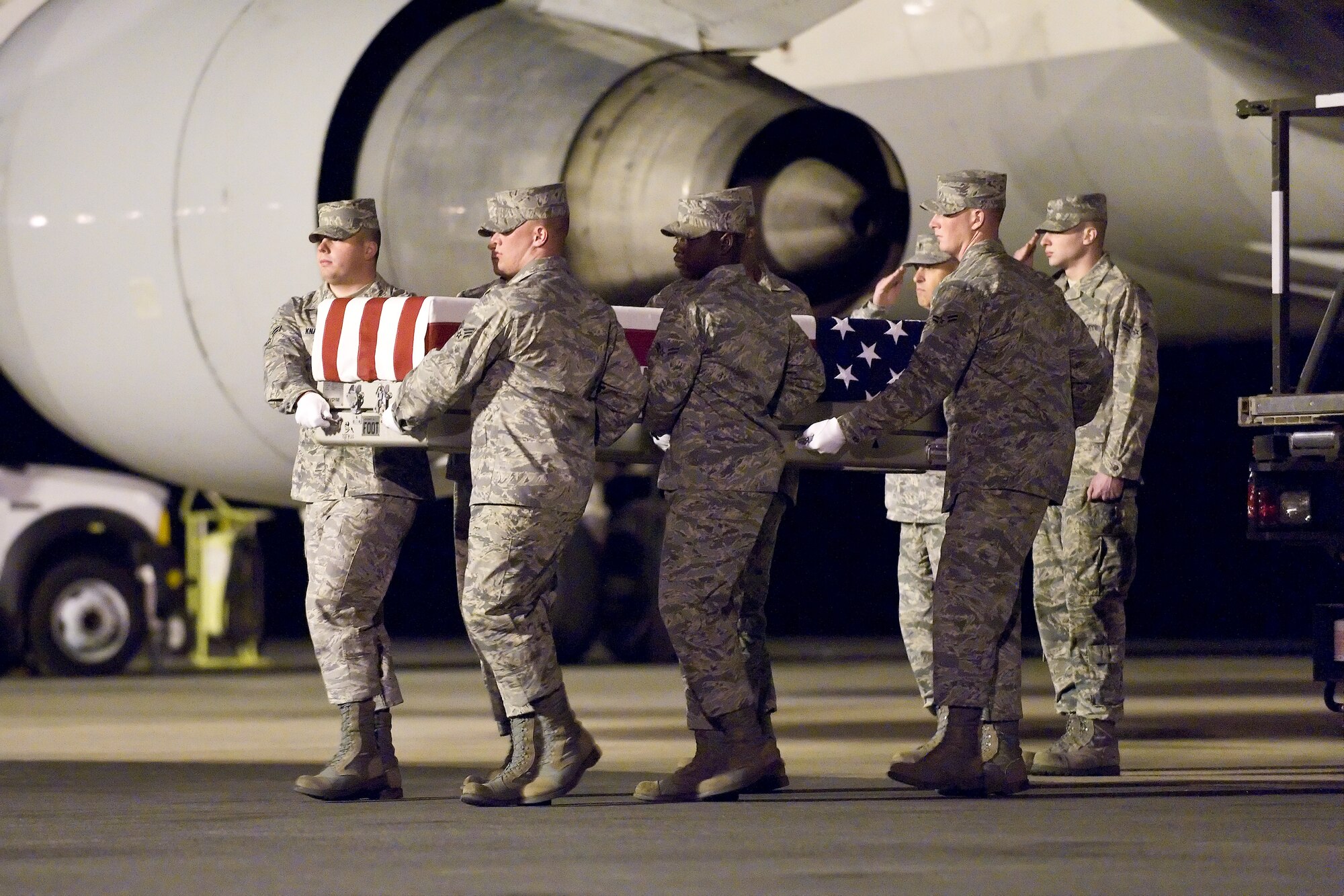 A U.S. Air Force carry team transfers the remains of Air Force Maj. Philip D. Ambard, of Edmonds, Wash., at Dover Air Force Base, Del., April 30, 2011. Ambard was assigned to the 460th Space Communications Squadron, Buckley Air Force Base, Colo. (U.S. Air Force photo/Roland Balik)