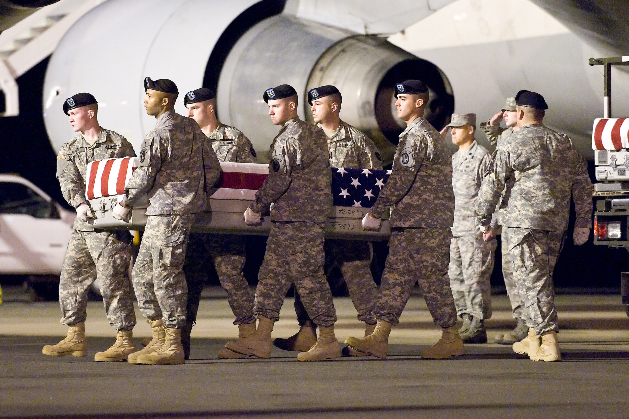 A U.S. Army carry team transfers the remains of Army Spc. Andrew E. Lara, of Albany, Ore., at Dover Air Force Base, Del., April 30, 2011. Lara was assigned to F Company, 145th Brigade Support Battalion, attached to the 3rd Battalion, 116th Cavalry Regiment. (U.S. Air Force photo/Roland Balik)