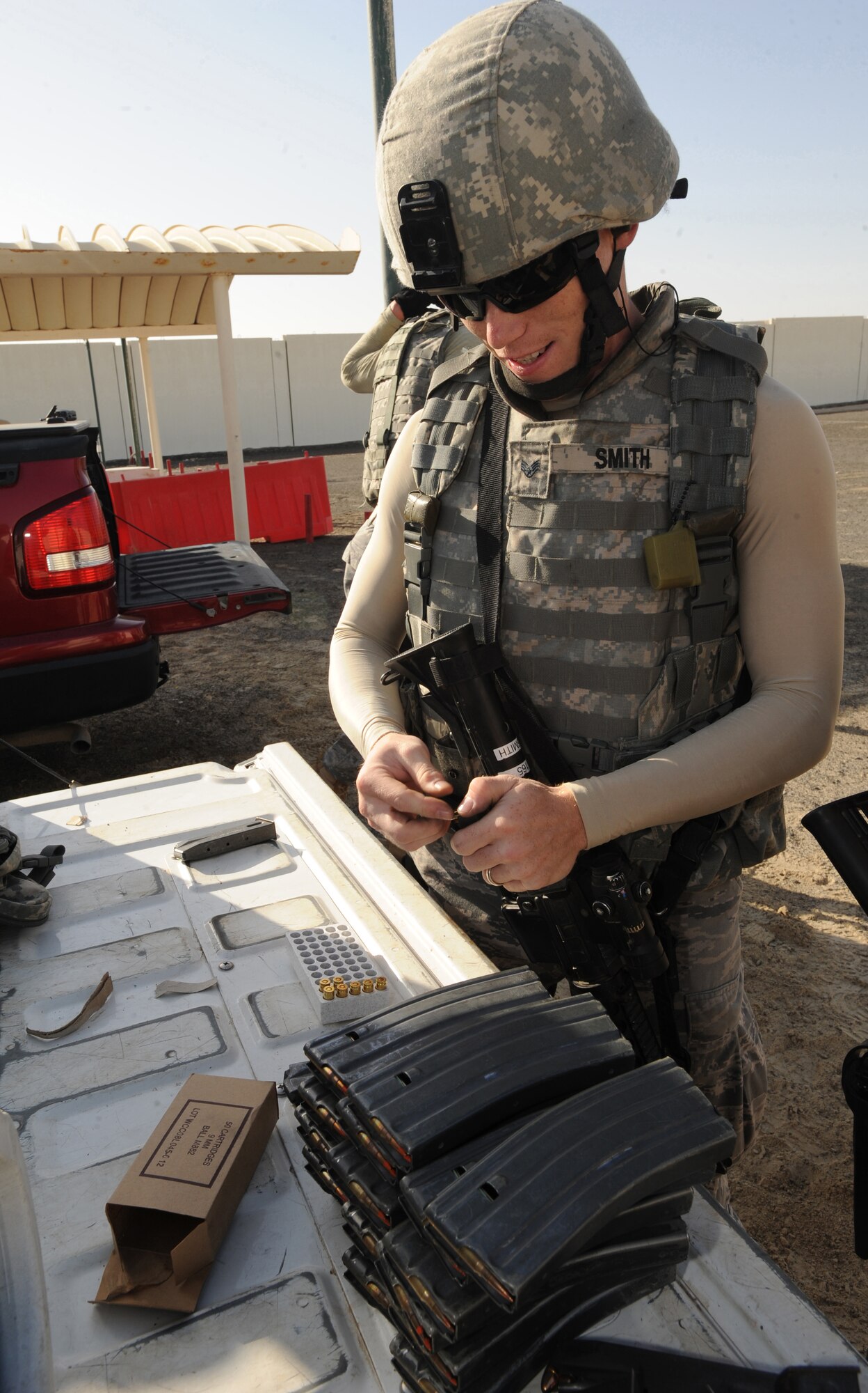 Staff Sgt. Charles Smith, 380th Expeditionary Security Forces Squadron, loads magazines before beginning target practice at the firing range Mar. 4, 2011, in Southwest Asia. Security Forces must remain up to date on all training to prepare them for quick response to any real world situation, anytime. (U.S. Air Force photo by Senior Airman Maynelinne De La Cruz)