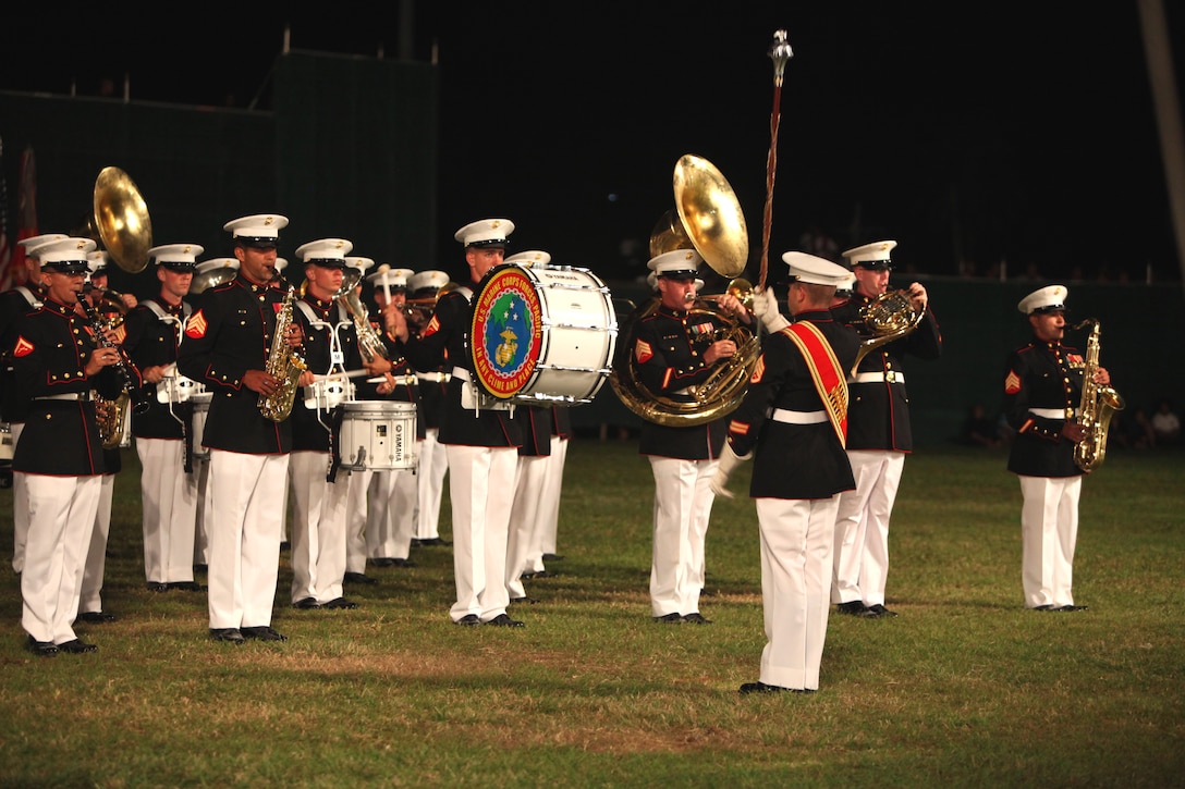 The U.S. Marine Corps Forces, Pacific, Band from Hawaii performs a medley of patriotic songs during the Kingdom of Tonga Military Parade and Tattoo, Aug. 2. A Tattoo is comprised of military units – musical and operational – from different countries collaborating in an extensive exhibition of musical performances and demonstrating military capabilities.