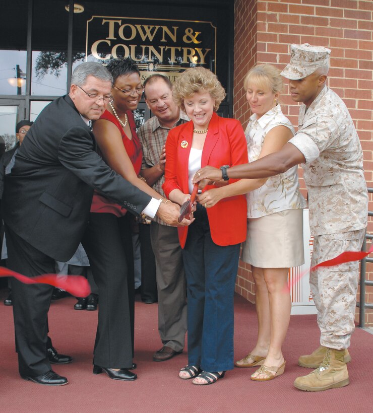 Town and Country Restaurants and Banquet Center, Building 7450, re-opens with a ceremonial ribbon-cutting, Monday. From left: Dick French, BJ Williams, Mike Noble, Terri Braden, Kelly Goddard and Col. Terry V. Williams.