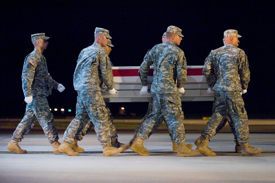 A U.S. Army carry team transfers the remains of Army Sgt. William B. GrossPaniagua of Daly City, Calif., at Dover Air Force Base, Del., Aug. 1, 2011. He was assigned to the 3rd Brigade Special Troops Battalion, 3rd Brigade Combat Team, 25th Infantry Division, Schofield Barracks, Hawaii. (U.S. Air Force photo/Adrian Rowan)